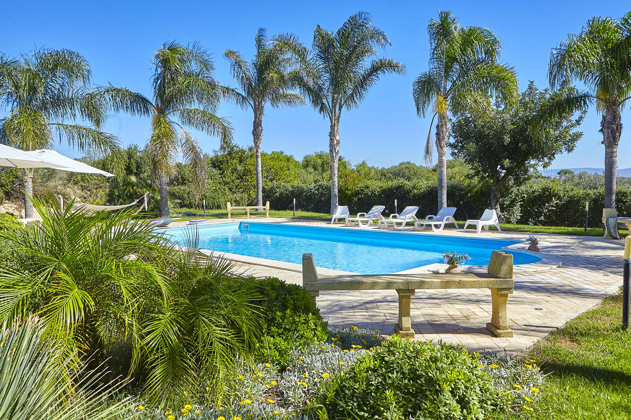 Ground floor: (Living room(TV), dining room, Kitchen(electric kettle, toaster, oven, microwave), bathroom(bath tub), fireplace)\n\nOn the 1st floor: (bedroom(double bed), bedroom(double bed), bedroom(single bed, single bed), bedroom(single bed, single bed), bathroom(shower))\n\nbathroom, dishwasher, shower(outside), washing machine, heating(electric, central), air conditioning, terrace(private), garden(private), garden furniture, garden furniture, BBQ, parking, swimming pool(private, 14 x  7 m., opened from May upto and including Sep), iron, hairdryer