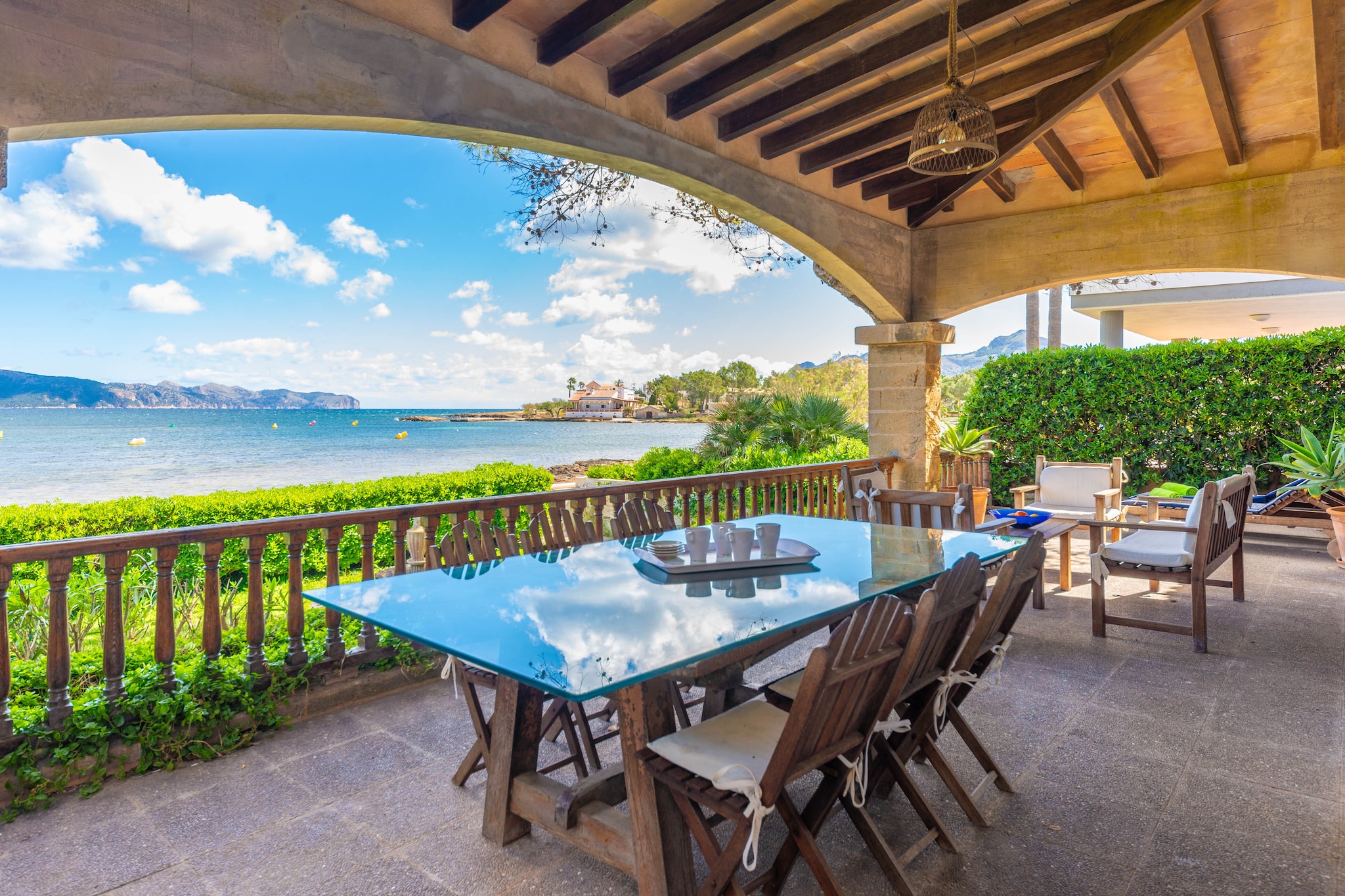 The sea views from the porch and the private garden make this small house an exceptional place to spend a few days of holidays, rest and relaxation. From the garden there is a direct access to a rocky beach where you can enjoy a swim. The stairs of the garden give us access to the entrance of the house, but not before passing through the beautiful porch furnished with sun loungers, chairs and a table where to enjoy a good meal outdoors while enjoying the sea views.
Distributed on one floor, the interior of the property has a rustic style. At the entrance of the house we will find a very luminous open space where we find the first living room of the house and the dining room. This room has two armchairs and a very comfortable sofa where you can watch a movie in the evening thanks to the Smart TV. The dining room is ideal to eat with your companions the food prepared on the gas cooker fully equipped with all the necessary utensils to cook comfortably throughout the stay. The second living room also has another TV, a sofa and an armchair. When it's time to sleep, there are 4 bedrooms for all the guests, all with wardrobe and fan for the hottest nights. Three bedrooms have a double bed and the fourth has a bunk bed. Finally, two complete bathrooms with shower and an en suite bathroom without shower serve the whole house. If you are travelling with a baby, a cot and high chair will be provided. You can make use of the washing machine, iron and ironing board.
Located in Marina Manresa, 1.4 km from the town of Alcudia where you will find all the necessary services such as bars, restaurants, shops, supermarkets, etc., including beautiful places to visit, such as its mythical walls. At a distance of 3.6km, you will find the port of Alcudia, a beautiful promenade full of leisure and restaurants where you can enjoy the local gastronomy. If you wish to enjoy a day of golf, you can opt for the Alcanada Golf Club located 7 km from the property. Consult the advertiser for possible charges. Pets are not allowed. The holding of events is forbidden.
Distances
Beach: 0.650 km - Platja Es Morer Vermell
Airport: 60.3 km - Palma de Mallorca
Golf course: 7 km - Club de Golf Alcanada
Town: 1.4 km - Alcúdia
Train station: 16 km - Sa Pobla
Bus stop: 1.8 km - Alcúdia
Ferry: 3.6 km - Port d'Alcúdia
Hospital: 1.2 km - Centre de Salut es Safrà d'Alcúdia
Tourist license: ETV/11151There's a mandatory tourist tax in Balearic Islands, called Ecotasa. All guests, except people under 16 years, have to pay this tax. The amount varies between 0.55€/night and guest during the low season and 2.2€/night and guest during the high season .The tax is reduced by half from the 9th day for your stay.