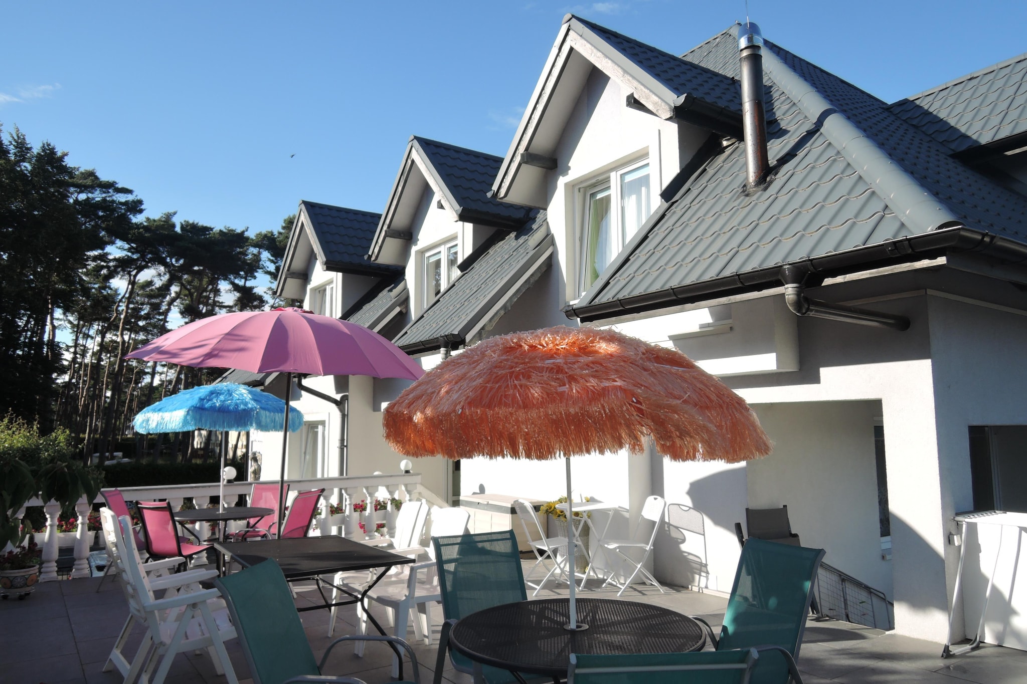 We invite you to relax in Dziwnówek. Our holiday home is only 100 meters from the center of Dziwnówek. We are only 150 meters to the clean, wide beach, and only 200 meters to the Kamieński Reservoir.
We offer our guests a comfortable stay in studios for 4 people, two adults and two children (room with bathroom).
For a symbolic amount (PLN 5 per person), we rent on site: deckchairs, screens, umbrellas and Nordic Walking poles.
The property has a large terrace and a special barbecue area. Guests also have access to the Internet.
We also provide a fenced parking lot.
Dziwnówek is one of the most frequently visited towns by the sea. One of the biggest attractions is the wide and clean beach. It is surrounded by dunes covered with rare vegetation. An interesting fact is that the sea water in this region is not contaminated with industrial pollution and is considered the cleanest in the entire Pomerania.
Dziwnówek is an ideal place for water sports. In Dziwnówek you can go pedal boating, water skiing, and practice increasingly popular sports such as windsurfing and kitesurfing. There is also a Winsurfing School in the town for both beginners and advanced surfers.
Dziwnówek is also a paradise for anglers who can fish both in the Baltic Sea and in the Kamieński Reservoir. Interestingly, the water in the Lagoon is sometimes salty, because during strong winds, sea water retreats towards the lagoon instead of going deep into the sea. Therefore, in the town we can catch saltwater and freshwater fish species.
One kilometer from Dziwnówek, in Wrzosowo, there is the Baltic Dinosaur Park. It is an ideal place for the whole family, focused on active outdoor recreation.