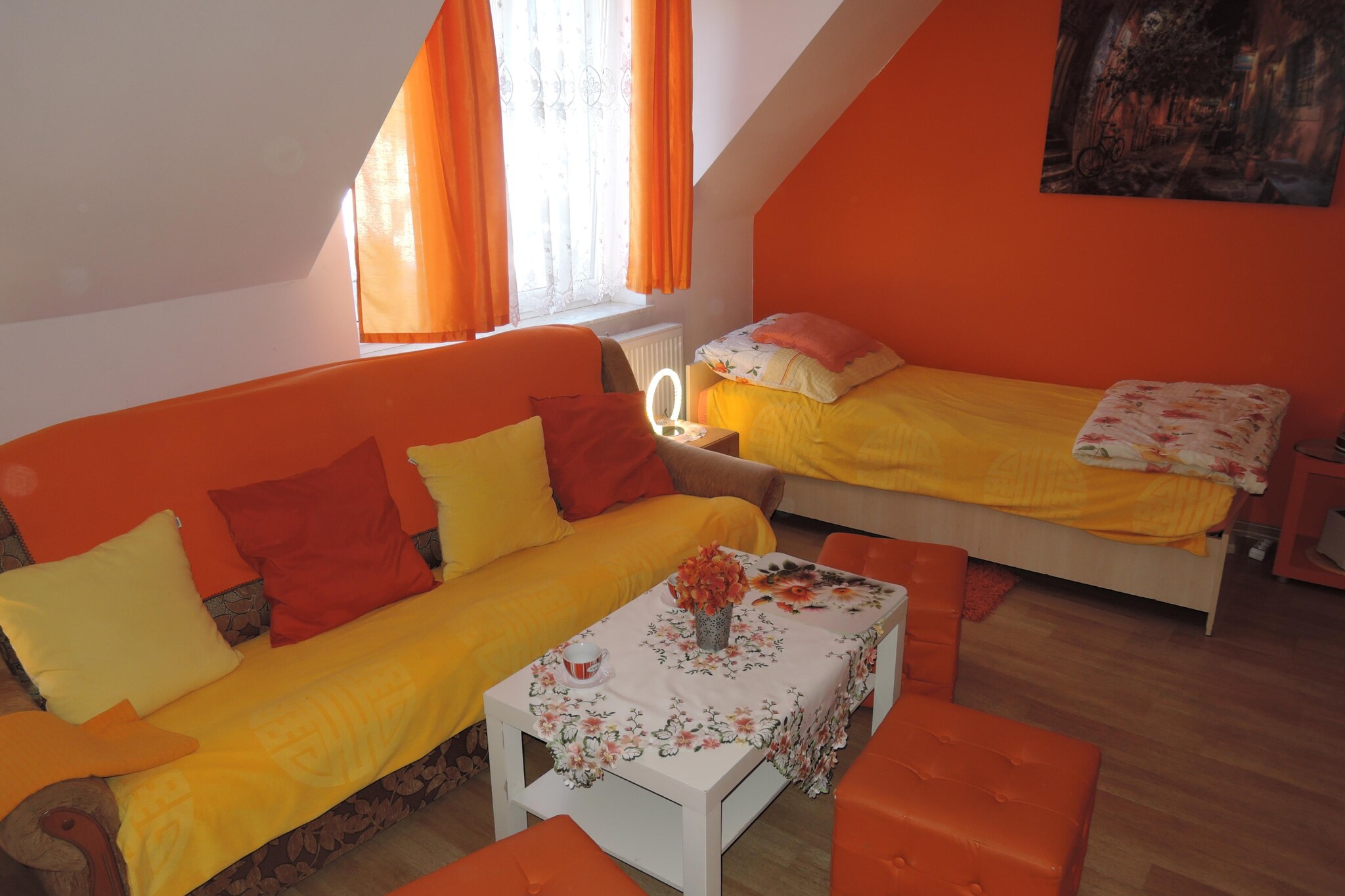 We invite you to relax in Dziwnówek. Our holiday home is only 100 meters from the center of Dziwnówek. We are only 150 meters to the clean, wide beach, and only 200 meters to the Kamieński Reservoir.
We offer our guests a comfortable stay in 5-person studios (room with bedroom and bathroom).
For a symbolic amount (PLN 5 per person), we rent on site: deckchairs, screens, umbrellas and Nordic Walking poles.
The property has a large terrace and a special barbecue area. Guests also have access to the Internet.
We also provide a fenced parking lot.
Dziwnówek is one of the most frequently visited towns by the sea. One of the biggest attractions is the wide and clean beach. It is surrounded by dunes covered with rare vegetation. An interesting fact is that the sea water in this region is not contaminated with industrial pollution and is considered the cleanest in the entire Pomerania.
Dziwnówek is an ideal place for water sports. In Dziwnówek you can go pedal boating, water skiing, and practice increasingly popular sports such as windsurfing and kitesurfing. There is also a Winsurfing School in the town for both beginners and advanced surfers.
Dziwnówek is also a paradise for anglers who can fish both in the Baltic Sea and in the Kamieński Reservoir. Interestingly, the water in the Lagoon is sometimes salty, because during strong winds the sea water retreats towards the lagoon instead of going deep into the sea. Therefore, in the town we can catch saltwater and freshwater fish species.
One kilometer from Dziwnówek, in Wrzosowo, there is the Baltic Dinosaur Park. It is an ideal place for the whole family, focused on active outdoor recreation.