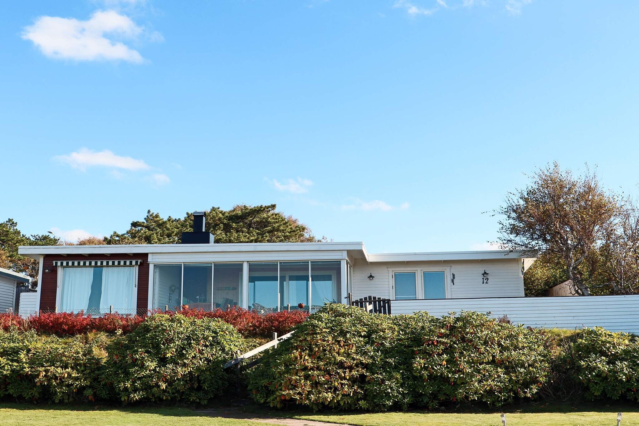 Kitchen(cooker(electric), coffee machine, microwave, dishwasher, fridge-freezer), Living/bed room(fireplace, DVD player), bedroom(double bed), bedroom(2x single bed), bedroom(single bed, 2x bunk bed), bathroom(washbasin, shower, toilet, washing machine), bathroom(outdoor shower(outside), washbasin, shower, toilet), sauna(outside, 6 persons), heating(electric), air to air heatpump