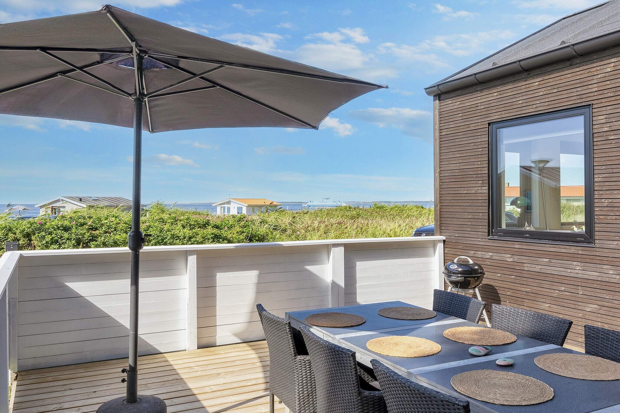 Kitchen(stove(induction), coffee machine, microwave, dishwasher, fridge-freezer), Living/bed room(TV(danish TV channels (DR1 and TV2), norvegian TV channels , swedish TV channels)), bedroom(double bed, high chair), bedroom(single bed), bathroom(washbasin, shower, toilet), mezzanine(2x single folding bed), Bubble bath(outside, heated, 2 persons), balcony or terrace, heating(electric), garden furniture, air to air heatpump