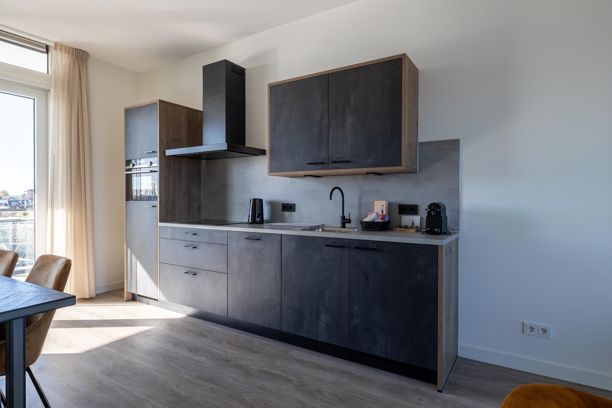 On the 1st floor: (Living room(seating area), Kitchen(electric kettle, cooker, coffee machine, dishwasher, fridge-freezer), bedroom(double bed), bedroom(double bed), bathroom(shower, washbasin), toilet, balcony or terrace)