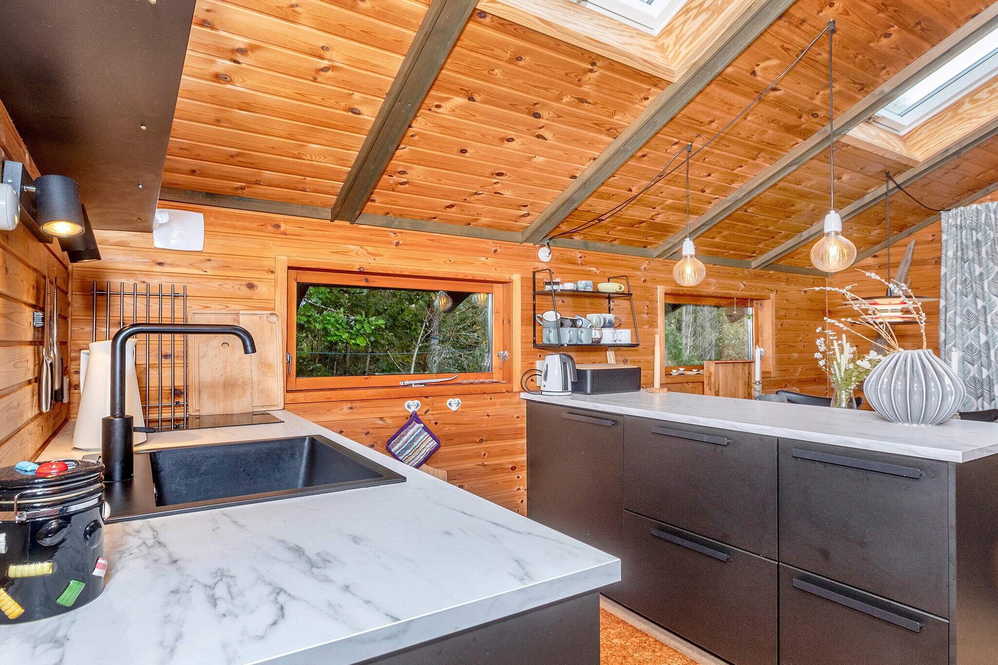 Annex: (double bed)\n\nSitting room, Kitchen(cooker(electric), fridge(+ freezer)), Living/bed room(TV, stereo unit, chromecast), bedroom(double bed), bathroom(washbasin, shower, toilet), heating(electric), terrace, garden furniture, sun loungers, darts, air to air heatpump