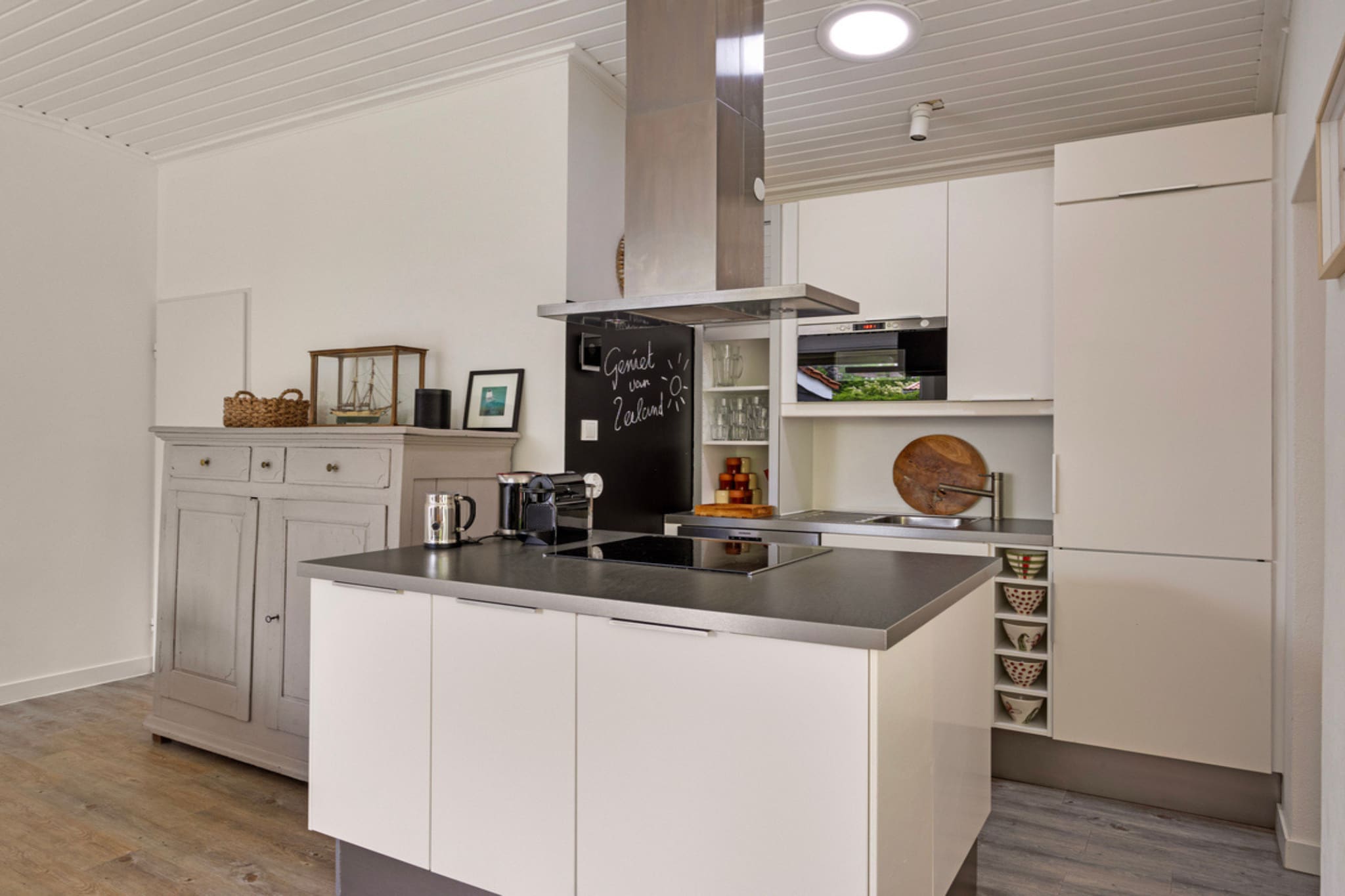 Ground floor: (Living room(TV, dining table, seating area), Kitchen(electric kettle, cooker, coffee machine, oven, fridge, freezer), bedroom(double bed), bedroom(bunk bed), bedroom(double bed), bathroom(shower, washbasin), bathroom(washbasin, toilet), toilet(toilet))\n\ngarden, BBQ, parking