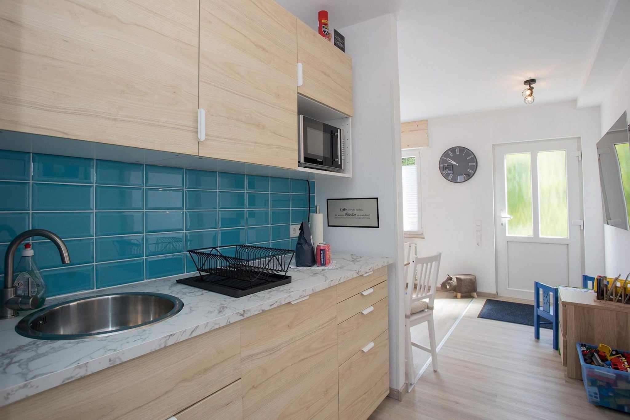 Stay in this comfortable four-person apartment, equipped with all conveniences. Located in the German Winterberg, close to the ski and recreation area. Outside the ski season, you can enjoy beautiful hikes through the mountains. Follow the various hiking trails and enjoy nature. In the cozy village, you will find all basic facilities and nice dining options.
In this ground-floor apartment, you will find a living room, kitchen, bathroom, and one bedroom. The living room is cozily furnished with a sofa for 2-3 people, a coffee table, and a television. Against the wall is a dining table with 4 seats. For the little ones, there is a cozy play corner with some toys.
The kitchen, around the corner from the living room, is equipped with a combination microwave, fridge with freezer compartment, and a toaster. Note: a dishwasher is not available. For a delicious cup of coffee or tea, there is a filter coffee maker and a kettle available.
The bedroom has a double bed (140x200 cm) and a bunk bed with two mattresses (90x200 cm). So, you sleep in this accommodation with four people in one room. Furthermore, there are nightstands, bed lighting, and a wardrobe for storing luggage. Under the bed, you will find two drawers with extra storage space.
The bathroom is equipped with a sink with storage unit and mirror, a shower cabin, toilet, and a washer/dryer combination, so you can do laundry during your vacation. The house has a terrace of approximately 12 m² located on the northeast. Note: there is no garden furniture available.
For children up to 2 years old, there is a foldable baby bed and a high chair available, as well as the previously mentioned toys in the living room.
One parking space is included with this accommodation. Unfortunately, pets are not allowed.
Winterberg, located in the heart of the Sauerland, Germany, is a destination you must discover. Whether you are looking for adventure, relaxation, or a combination of both, this picturesque area has something for everyone. Winterberg is known for its breathtaking landscapes. The vast forests, rolling hills, and crystal-clear lakes provide a perfect setting for nature lovers. Take a walk or bike ride through the beautiful nature and enjoy the peace and quiet this area has to offer.
For the adventurers among us, there is plenty to do in Winterberg. In the winter months, you can ski and snowboard excellently here. The well-maintained slopes and modern facilities make it a popular destination for winter sports enthusiasts. But there is also plenty to do in the summer. Try the toboggan run, go mountain biking, or dare to take on an exciting climb in the climbing forest. A visit to Winterberg is not complete without enjoying the local cuisine. Taste the delicious dishes prepared with love and care. From traditional German dishes to international specialties, there is something for everyone. Don't forget to try a local beer or a glass of wine with your meal.
Are you excited about Winterberg? Then plan your visit soon and discover for yourself what this beautiful area has to offer. Whether you come for nature, culture, or adventure, Winterberg will certainly not disappoint you.