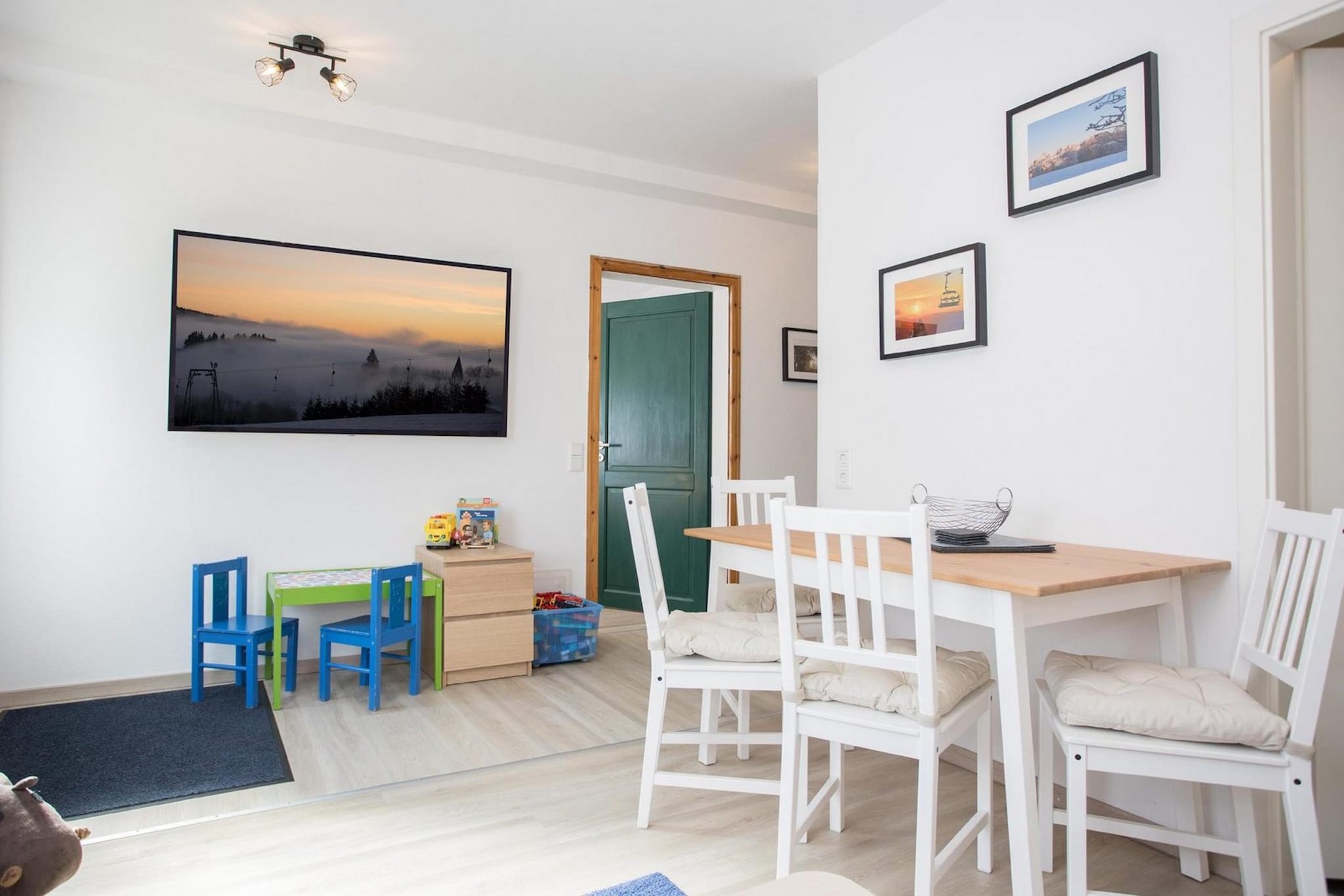 Ground floor: (Entrance, hall, open kitchen(hob, electric kettle, toaster, coffee machine(filter), combination microwave, fridge(+ freezer)), Living/diningroom(TV, dining table, seating area), bedroom(double bed(140 x 200 cm), bunk bed(90 x 200 cm)), bathroom(tumble dryer, shower, washbasin, toilet, washing machine))\n\ncot, terrace(12 m2), parking, high chair, toys