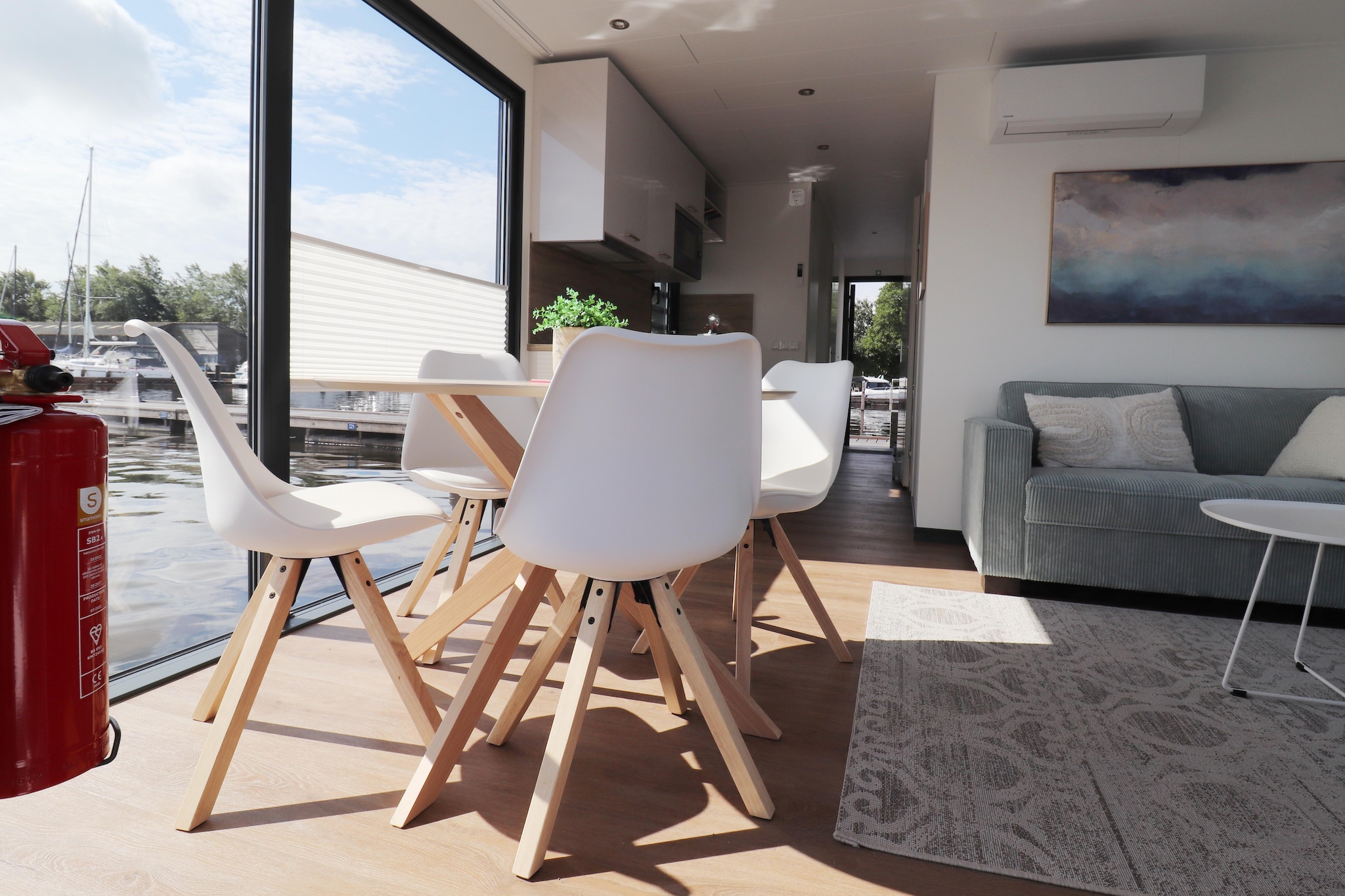 Ground floor: (hallway, Living room(TV, dining table, seating area), open kitchen(hob, electric kettle, hood, coffee machine(cups), combination microwave, dishwasher, fridge-freezer), bedroom(double bed), bedroom(single bed, single loft bed), bathroom(shower, washbasin, toilet))\n\nterrace, garden furniture