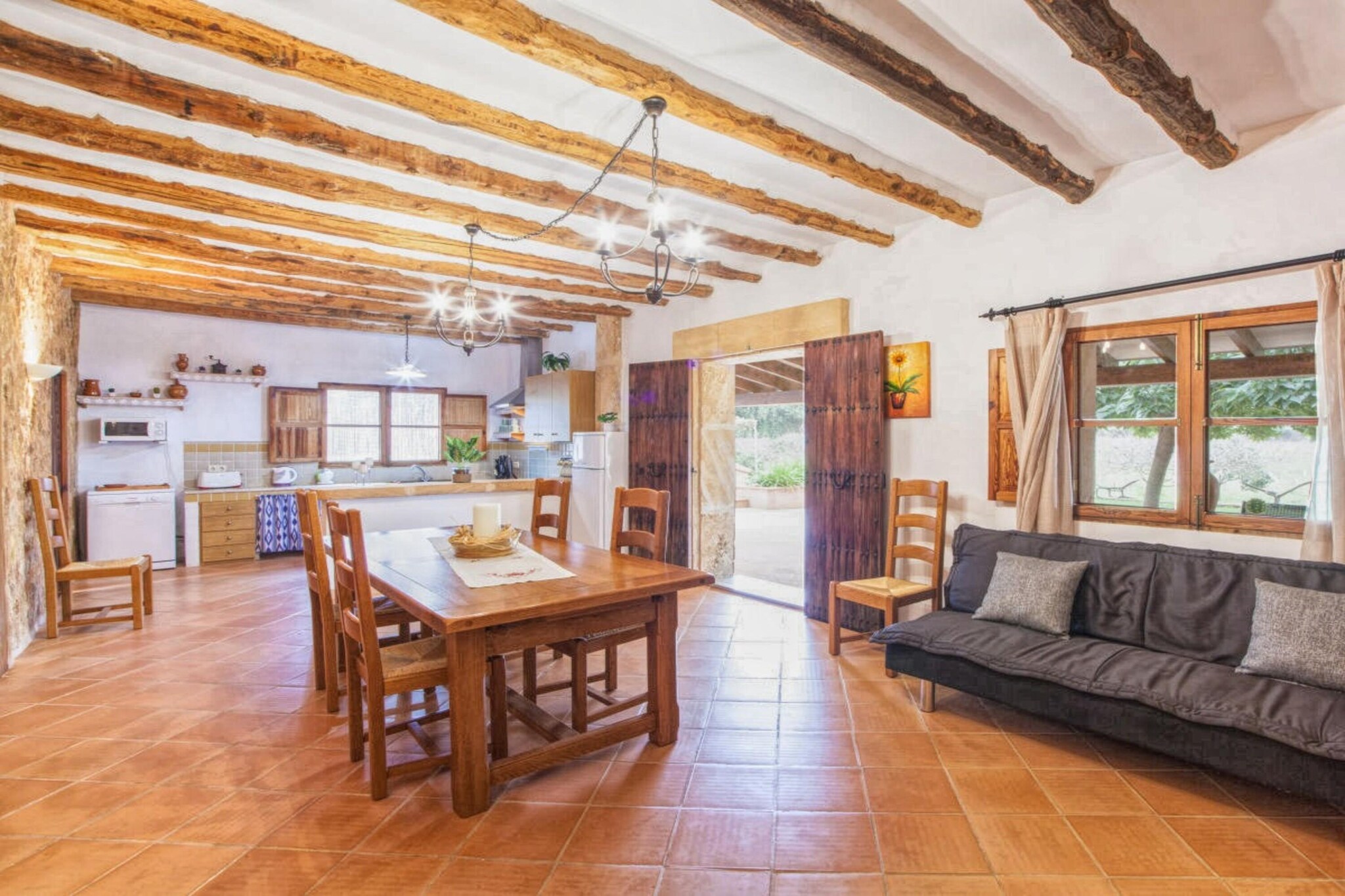 Welcome to your ideal holiday retreat in Manacor, where comfort and relaxation await in this splendid two-story home. Upon entering the first floor, you are greeted by a spacious open kitchen, fully equipped with modern appliances and ready for culinary adventures. Adjacent, the inviting living and dining area awaits, featuring a TV, a dining table for shared meals, and a cozy seating area. Air conditioning and heating ensure year-round comfort, whether you're seeking shade from the sun or warmth during cooler evenings. Venture up to the second floor to discover comfortable bedrooms, thoughtfully designed for peaceful nights and rejuvenating sleep. 
Situated amidst serene surroundings, this property offers a perfect blend of modern amenities and tranquility. The beautiful sea beach is just 21 km away, making it a convenient escape for sun-seekers and water enthusiasts alike. While secluded enough for peace and privacy, this holiday home is conveniently located just 5 km from restaurants and shopping, allowing you to easily explore local cuisine and indulge in retail therapy. 
 Step outside into your private oasis where relaxation and recreation come together seamlessly. Enjoy a refreshing dip in the sparkling private swimming pool, perfect for cooling off under the Mediterranean sun. For sports enthusiasts, a private tennis court awaits, providing opportunities for friendly matches and active pursuits. The outdoor amenities continue to impress with a terrace heater, ideal for cooler evenings spent stargazing or enjoying intimate conversations. A barbecue area invites you to savor grilled delights with loved ones, while a solarium offers a tranquil spot for sunbathing and soaking up the warm Spanish rays. Multiple seating areas throughout the outdoor space ensure everyone can find their favorite spot to unwind.