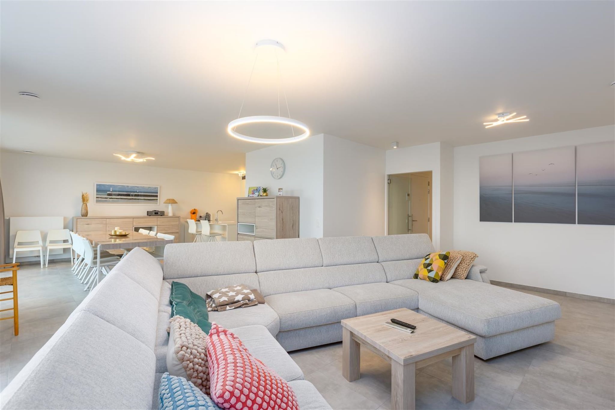 Welcome to your stunning new-build apartment, offering modern comfort and convenience just steps away from the sea in a prime location. Situated on the 7th floor, this beautiful apartment boasts a spacious living room with access to a sunny balcony, where you can enjoy panoramic views and soak up the sun throughout the day. The dining room provides a perfect space for enjoying meals with family and friends, creating memorable moments against the backdrop of coastal vistas.
Located just 100 meters from the beach, this apartment offers easy access to sun, sand, and surfing. Whether you prefer leisurely beach walks, water sports, or simply lounging under the sun, the beach is within reach for your enjoyment.
The well-equipped kitchen is a chef's delight, featuring a hob, hood, coffee machine, dishwasher, fridge, and freezer. Whether preparing a quick breakfast or a gourmet dinner, you'll find everything you need for culinary creativity. The apartment includes comfortable bedrooms designed for rest and relaxation after a day of seaside activities. A storage facility within the apartment houses a tumble dryer and washing machine, ensuring convenience for laundry needs. A notable feature of this property is the included parking space (no. 38) within the building, providing secure and hassle-free parking for your vehicle.
