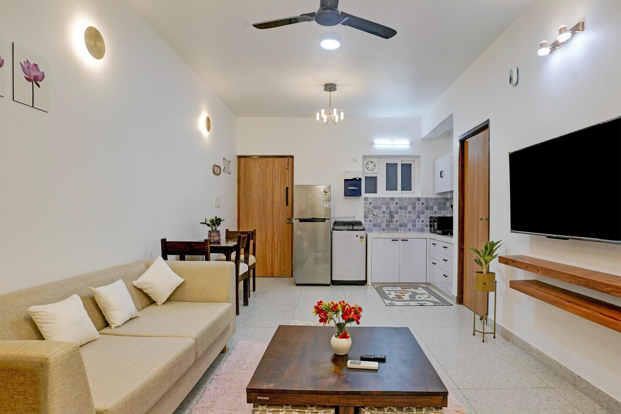 On the 1st floor: (Living room(TV(flatscreen), dining table), open kitchen(electric kettle, toaster, microwave, fridge, freezer, dishes and cutlery), bedroom(single bed, double bed, air conditioning, iron), bathroom(bathtub or shower, shower, washbasin, toilet, washing machine, hairdryer, Towels incl., shampoo, body soap), Dedicated workspace)\n\nswimming pool(shared with other guests), lift, drying cabinet, essentials(Towels, bed sheets, soap and toilet paper)