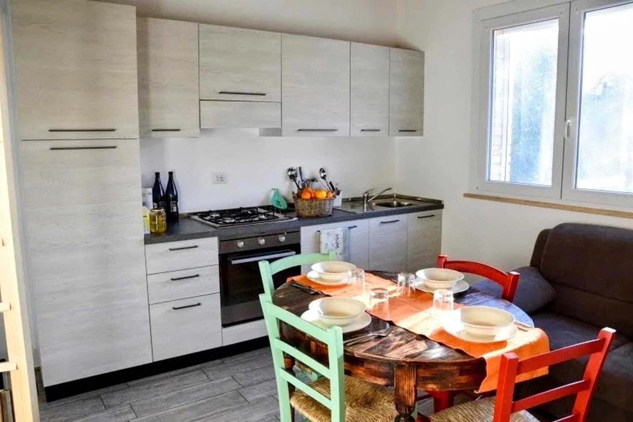 A perfect place for a holiday between sea, hills, nature, in the midst of the rolling hills of the Marche among orchards and olive groves. The apartment is located on the ground floor, with an independent entrance and can accommodate up to 5 people, with 1 double bedroom and a mezzanine with single beds. The air conditioning will keep you cool even on the hottest days. The farmhouse offers guests a large swimming pool with sun loungers. There is also an open-air gym and a play area for children. The long sandy beaches of the Adriatic can be reached by car in less than 10 minutes, while in the surrounding area there are dozens of small historic villages to visit and discover.