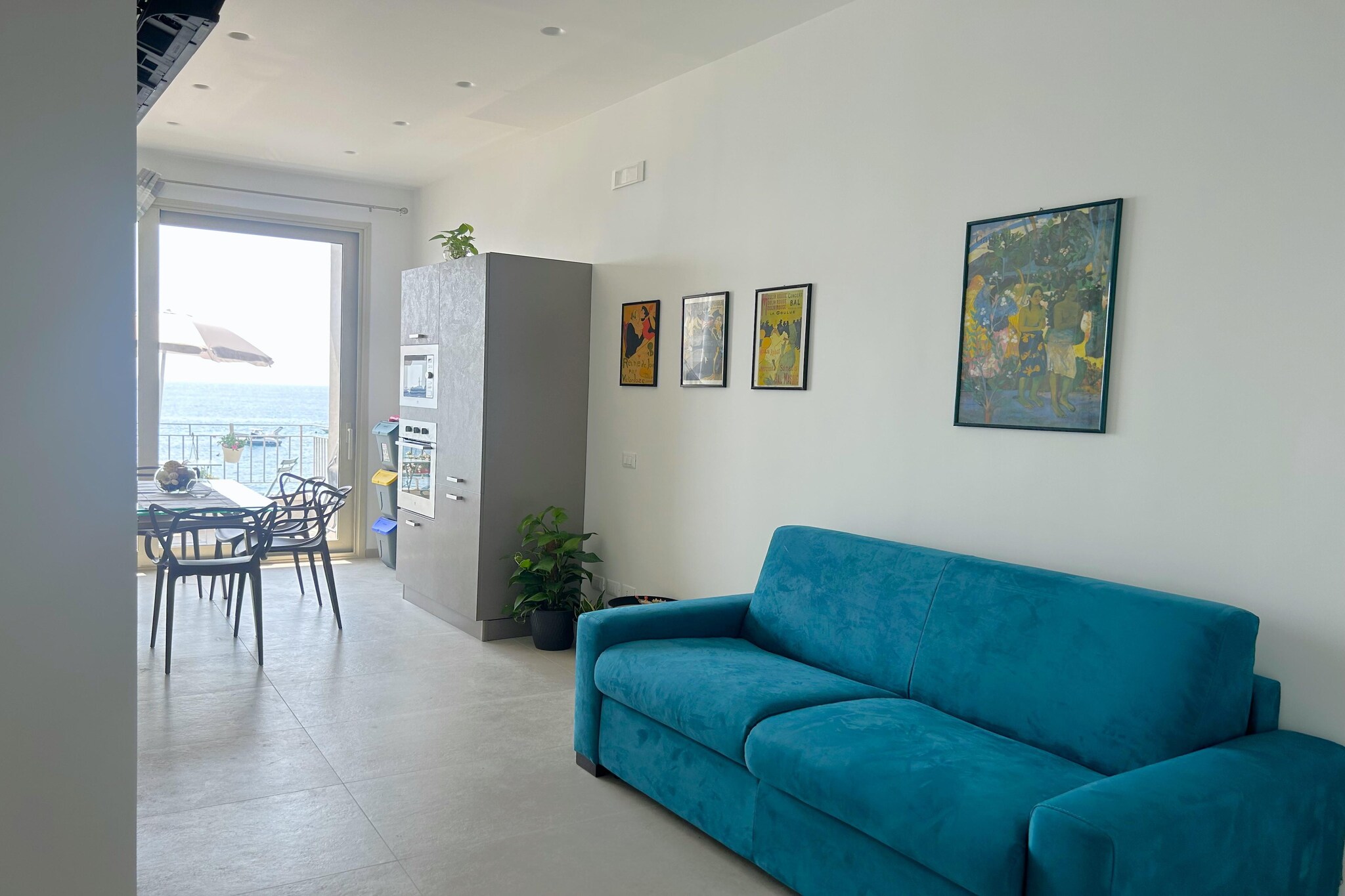 An optional utilities and service fee of EUR 100,00 will be charged before your arrival. Details are given below.<br> Your perfect holiday in Sicily! An elegant apartment equipped with all comforts just a few steps from the sea. A splendid view of the bay of Giardini Naxos and its wonderful sea, which you can admire and "experience" from a terrace that will leave you breathless! The apartment is perfectly located to enjoy the best of Giardini. The area where the house is located hosts shops, markets, characteristic restaurants and welcoming bars and is well connected by the nearby train and bus stations. Whether you are exploring the local attractions, relaxing on the beach or enjoying the lively city life, this apartment is the ideal base for an unforgettable holiday. Taormina is only 10 minutes away by car and Etna and its naturalistic and scenic beauties are also within easy reach. The apartment is newly built, has two views, is equipped with air conditioning in every room, and is composed of two bedrooms, a living room with a double sofa bed, a comfortable bathroom and a modern kitchen equipped for all your needs. An invitation to Sicily, to see, to live and to taste. Apartment on the 1st floor, in Corso Umberto I n.12, 110 square meters, composed of a balcony on the main street and a terrace overlooking the sea equipped with a tet a tet table, umbrella, outdoor sink, 1 bedroom with double bed double bed, 1 bedroom with two single beds that can be extended to accommodate an additional bed, large kitchen-living room with double sofa bed, 1 bathroom with shower, bidet, sink. <br><b> Optional Utilities & Service Package </b><br><b> An optional utilities and service package of EUR 100,00 </b> can be selected prior to your arrival. You will receive a separate communication with the payment link should you wish to include it.<br>This package ensures a seamless stay and conveniently covers services such as final cleaning, utility consumption, service support, and protection against minor damages or incidental costs during your stay.<br>Guests who prefer may manage these services independently, provided the property is returned in good order at check-out.