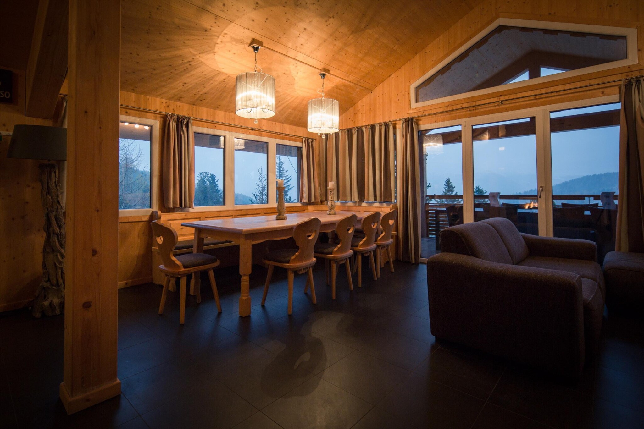 Discover the ultimate mountain retreat in this charming 130 mÂ² solid wood chalet, designed to accommodate up to 12 guests. Nestled in a serene pine forest at approximately 1,800 meters above sea level, this spacious chalet combines rustic charm with modern comforts for an unforgettable stay. 

 Set in a picturesque pine forest at around 1,800 meters, the chalet is perfectly positioned for outdoor activities, including hiking, skiing, and cycling. The tranquil environment offers a peaceful escape while remaining conveniently close to local attractions. 

The chalet features five cozy bedrooms, including four with double beds and one with two sets of bunk beds, making it ideal for large groups or extended families. With three well-appointed bathrooms, each equipped with a shower, convenience and comfort are guaranteed. Enjoy the stunning natural beauty from the private balcony, offering a perfect spot to unwind and soak in the tranquil surroundings. Relax and rejuvenate in the infrared sauna or luxurious whirlpool bathtub, designed to provide a soothing end to your day. The open kitchen is fully equipped to meet all your culinary needs, featuring cutlery, cookware, a ceramic hob, oven, dishwasher, and a fridge with a freezer compartment. Additional amenities include a toaster, kettle, and coffee machine.  Stay connected with free Wi-Fi and enjoy your favorite shows on satellite TV, making it easy to relax after a day of exploring. 

 Enhance your stay with the included Butler Card or Butler Programme, providing personalized services to make your experience as enjoyable and stress-free as possible. 

Embrace the comfort and charm of this beautifully crafted chalet, where every detail is designed to ensure a memorable and relaxing mountain getaway.