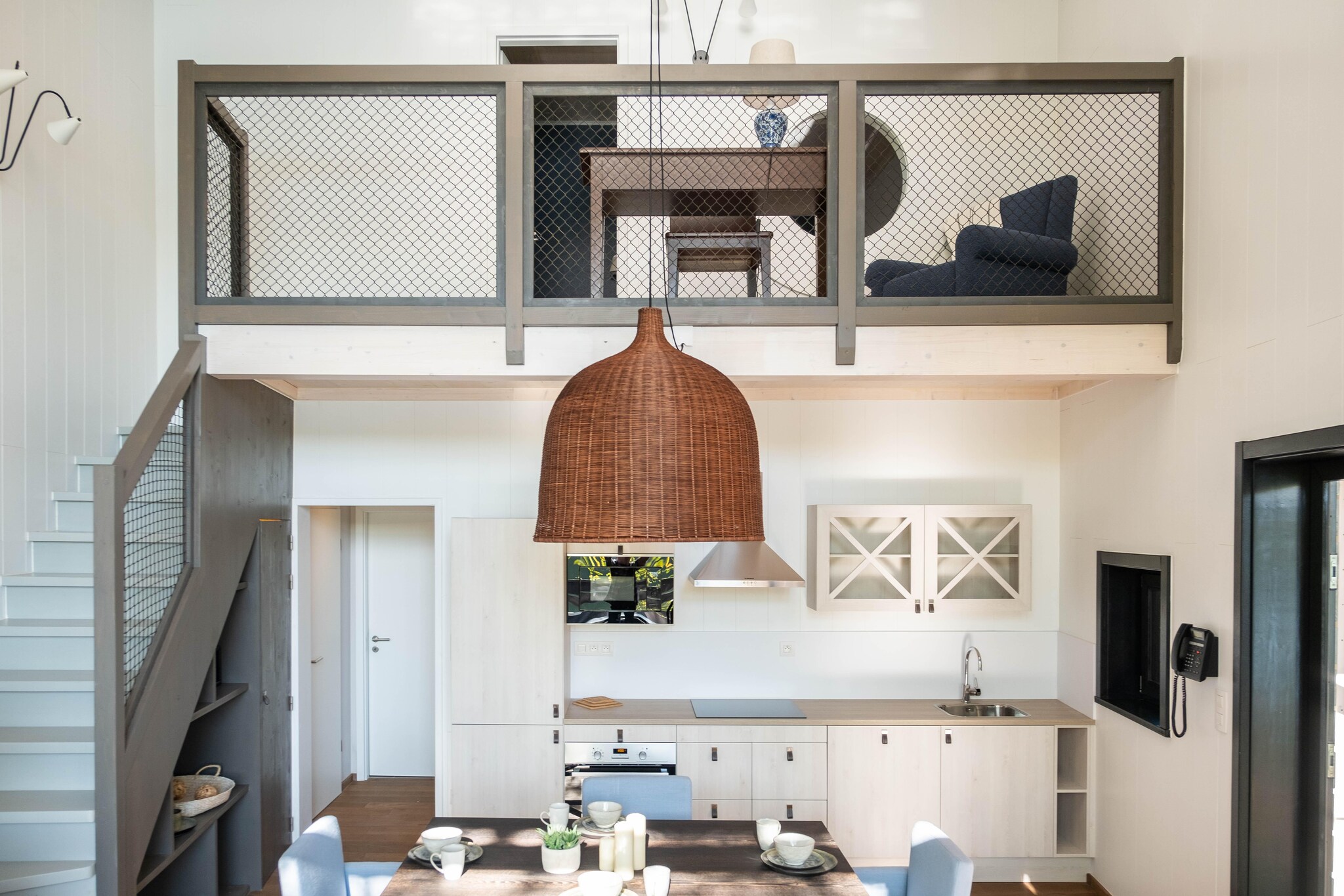 Ground floor: (Living room(TV(smart TV), dining table, fireplace, seating area), open kitchen(electric kettle, cooker, coffee machine(pads), oven, dishwasher, fridge-freezer), bedroom(single bed(80 x 200 cm), single bed(80 x 200 cm)), bathroom(shower(walk-in shower), washbasin), toilet(washbasin, toilet), Internet access)\n\nOn the 1st floor: (bedroom(double bed(160 x 200 cm)), bedroom(double bed(160 x 200 cm)), bathroom(bath tub, shower, washbasin, toilet), mezzanine(seating area))\n\nbalcony or terrace, garden, bicycle storage, garden furniture, parking, parking lot(public), pond, swimming pool(shared with other guests, indoor), swimming pool(shared with other guests, outside), boules court(shared with other guests), padel court, lounge set, party games, Charging post for electric cars