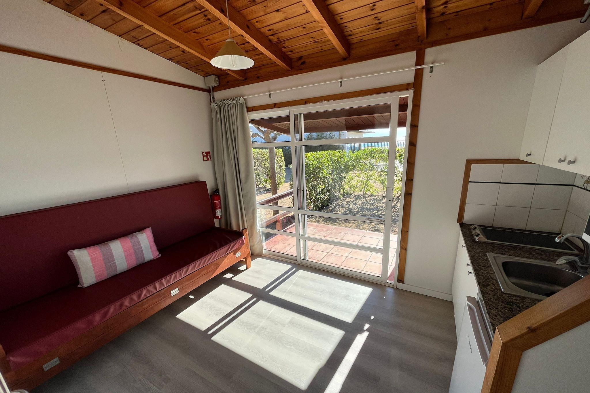 Ground floor: (Entrance, Living room(single sofa bed, TV), Kitchen(electric kettle, coffee machine, microwave, fridge, dishes and cutlery), bedroom(single bed), bedroom(single bed), bathroom(toilet))\n\nair conditioning, BBQ(charcoal), parking, heating