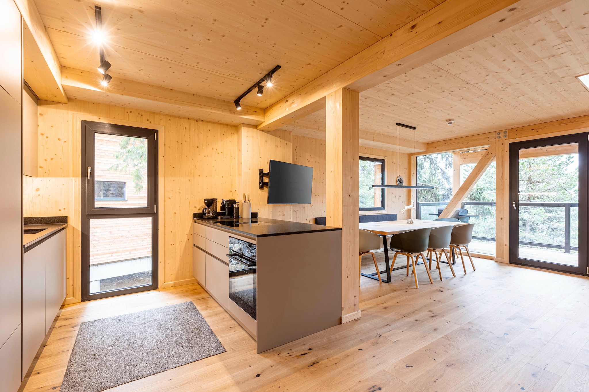 Ground floor: (Bedroom with bathroom(double bed, shower), Bedroom with bathroom(double bed, shower), Internet access)\n\nOn the 1st floor: (Entrance(ski boot heaters), Living room(TV, dining table, seating area), open kitchen(coffee machine(espresso, filter), dishwasher, fridge-freezer), toilet(toilet))\n\nOn the 2nd floor: (bedroom(double bed), bedroom(double bed), bathroom(hot tub, shower, sauna, balcony, hairdryer), toilet(toilet, balcony))\n\nheating(central), parking, parking, drying cabinet