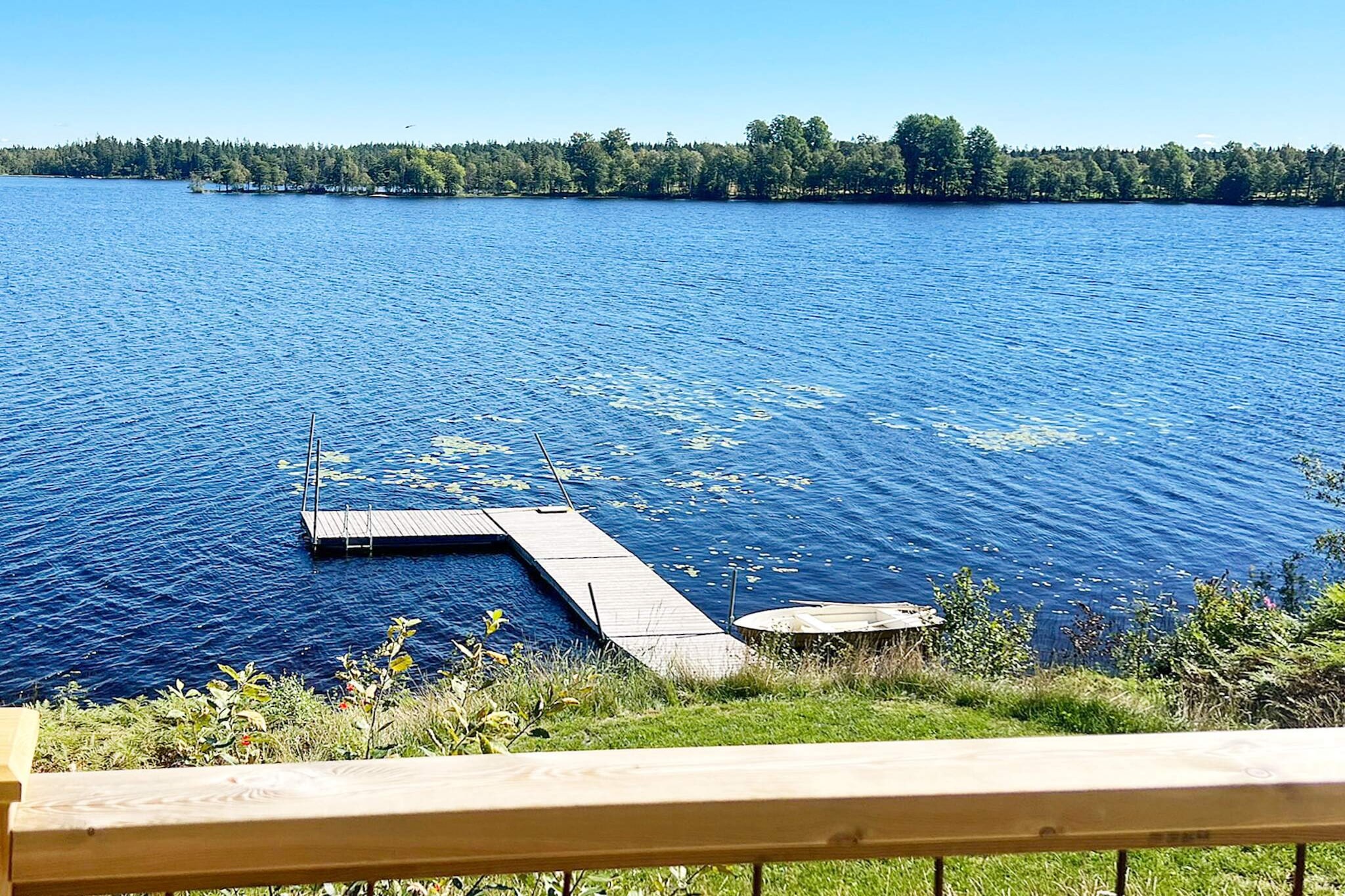 In the fantastic highlands of SmÃ¥land you will find this newly built fantastic cottage. With a wonderful view from the living room, dining room and the large balcony, you will spend the days here with advantage, whether in summer, spring or autumn. 30 meters down you have the lake and your own private jetty, the rowing boat is also included in the rent. Bathe, fish, swim to the local swing area 200m away and use the jumping tower thatâ€™s there. Or just enjoy looking out over the beautiful little lake. The house's common areas, such as the kitchen, living room and dining room, all face the lake and the large balcony. A large part of the balcony is under cover, so if the weather is against you, you can still use the lovely patio. Garbage sorting and recycling is applied here, see more info about this in the house. On the first floor, you have a bedroom with a double bed 160 cm and a bedroom with a pull-out bed that is 80/160 cm. (this bed is mainly intended for children and has slightly thinner mattresses than the other beds) Here is also the large bathroom, with washing machine /dryer. Upstairs you have a sleeping loft with two single beds (90cm) that can be placed next to each other if desired, as well as a 120 bed. In the small guest cabin, which has its own small patio, there is a sofa bed that is 140 cm wide. The rowing boat is included in the rent and there is also a range of different life jackets to borrow if needed, both children and adult sizes up to 90 kg. There is fiber in the house as well as a smart TV if you feel like watching something other than the fantastic view. With this wonderful location, it may happen that you have everything you need for your holiday right here. But should you fancy an excursion, JÃ¶nkÃ¶ping is a little over 40 km away, Isaberg Mountain Resort and High Chaparral 80 km away, and Astrid Lindgren's host about 100 km away. There is also a lot to do in the immediate area, experience nature on foot or by bike, there are cozy restaurants and cafes here. And also take the opportunity to visit Boda borg in SÃ¤vsjÃ¶, only a little over 20 km away.