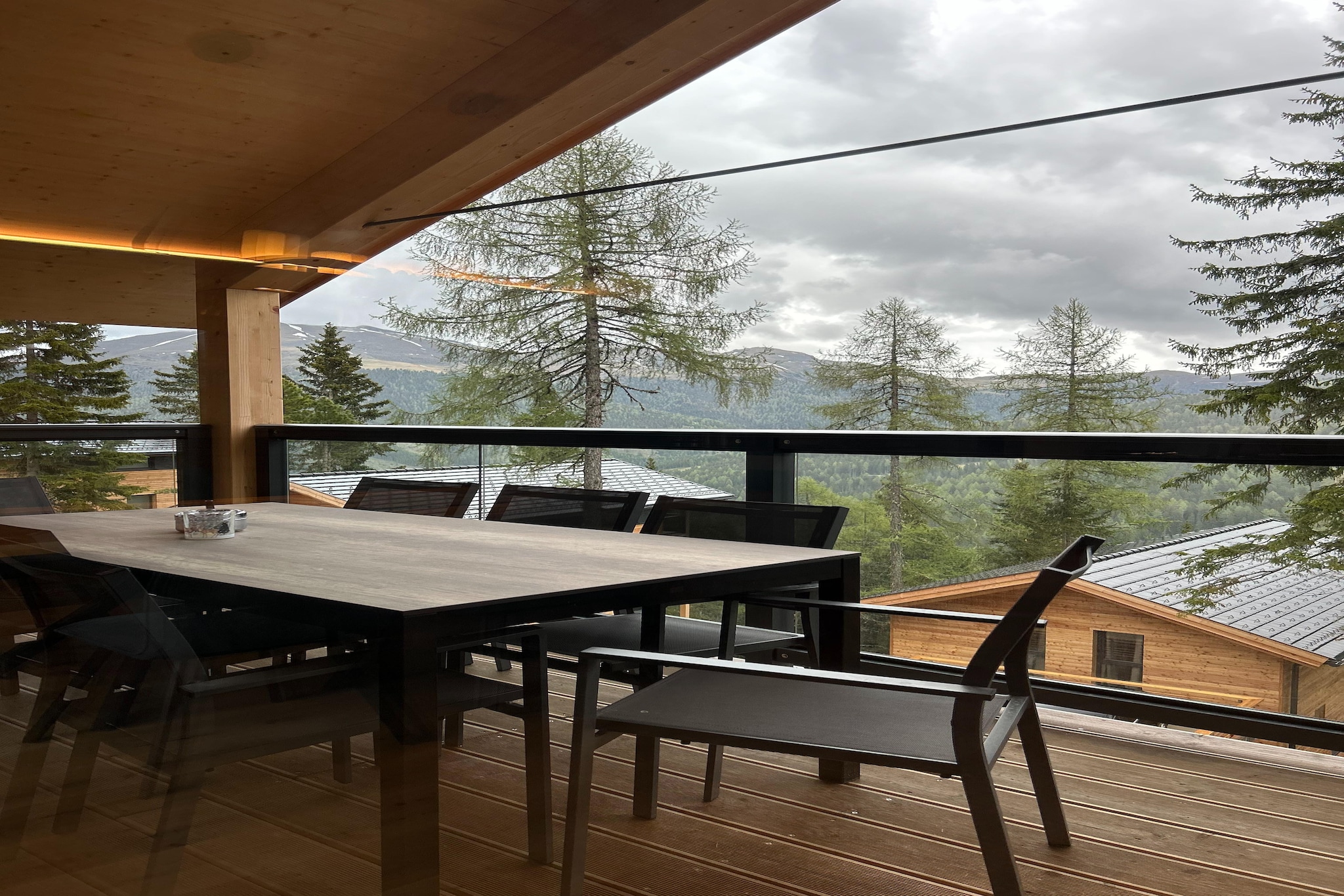 Ground floor: (Entrance(ski boot heaters), Bedroom with bathroom(double bed, toilet, balcony), Bedroom with bathroom(double bed, shower, washbasin), Bedroom with bathroom(double bed, shower), bathroom(shower, sauna, toilet, hairdryer), Internet access, hot tub, balcony)\n\nOn the 1st floor: (Living room(TV, dining table, seating area), open kitchen(electric kettle, coffee machine(cups, filter), oven, microwave, dishwasher, fridge(+ freezer), Juicer), bedroom(double bed), bathroom(bath tub, shower), toilet(toilet), balcony)\n\nheating(central), garden furniture, parking, parking, drying cabinet