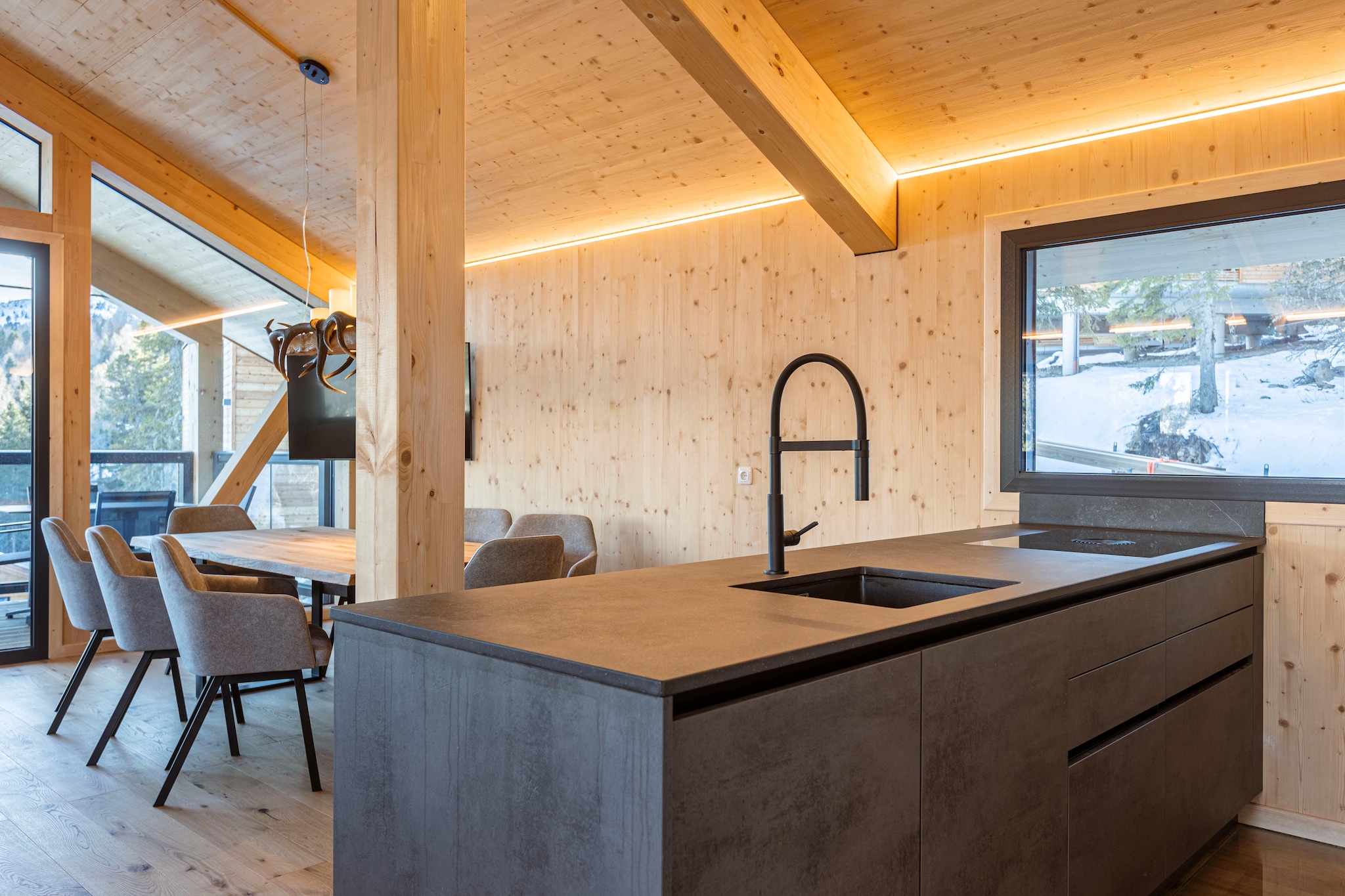 Ground floor: (Entrance(ski boot heaters), bedroom(double bed), Bedroom with bathroom(double bed, shower, toilet), Bedroom with bathroom(double bed, shower, toilet), Bedroom with bathroom, bathroom(shower, sauna, toilet, hairdryer), Internet access, hot tub, balcony)\n\nOn the 1st floor: (Living room(TV, dining table, fireplace, seating area), open kitchen(electric kettle, toaster, coffee machine(espresso, filter), oven, microwave, dishwasher, fridge(+ freezer)), bedroom(double bed), bathroom(bath tub, shower), toilet(toilet), balcony)\n\nheating(central), garden furniture, BBQ, parking, parking, drying cabinet