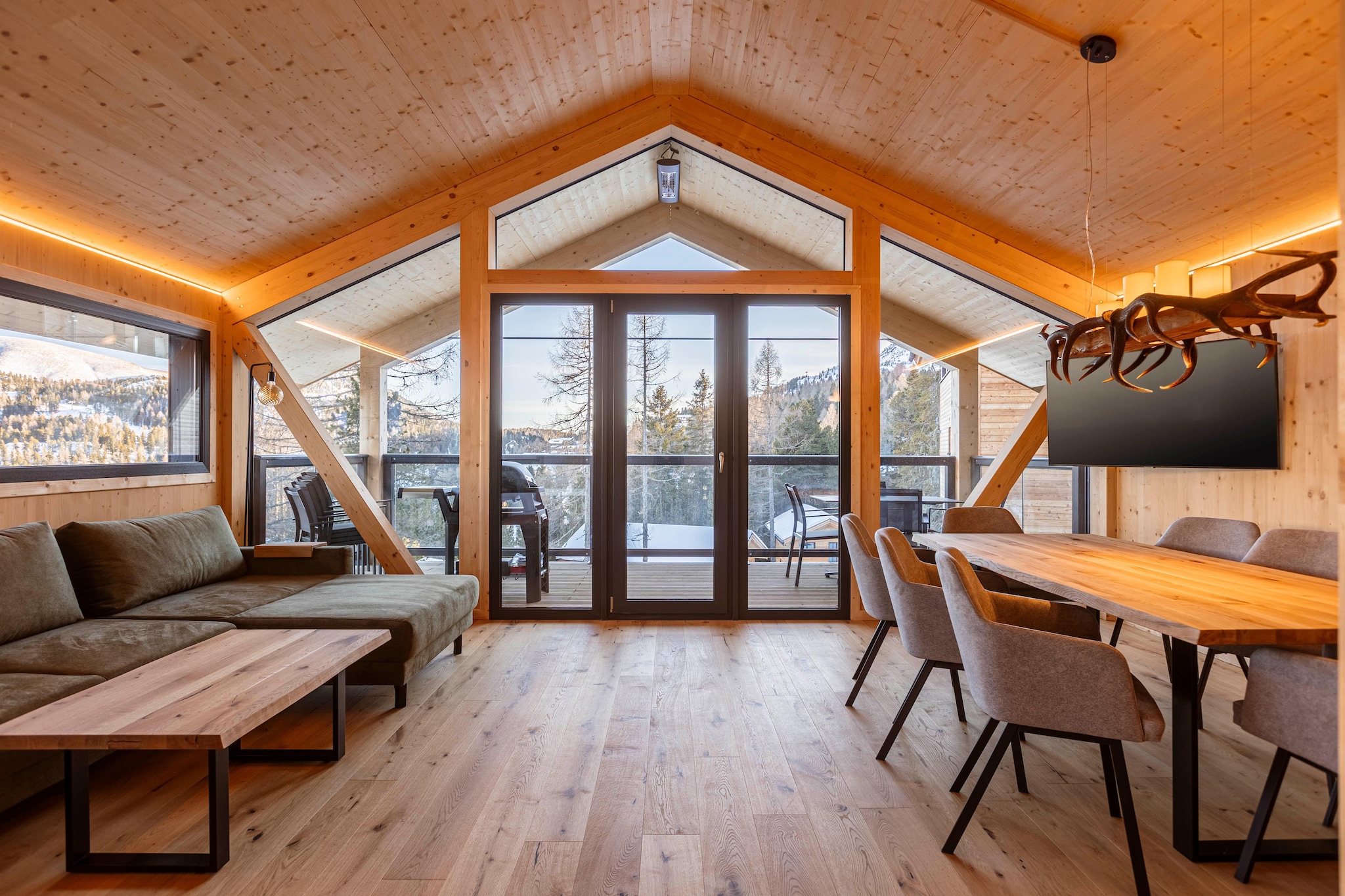 This delightful solid wood chalet, spanning 135 m² across two floors, offers a warm and inviting escape for up to 8 guests. The chalet features four cozy bedrooms: one on the ground floor with a double bed, en suite bathroom, and TV; two additional ground-floor bedrooms, each with a double bed, TV, and balcony; and a spacious upstairs bedroom with a double bed, separate double bed, and a bathroom with a bathtub. Relax after a day of adventure in the Finnish sauna indoors, or enjoy the spectacular views from the hot tub on the balcony, which provides a serene setting without whirlpool functionality.  
Turracher Höhe offering a range of activities year-round. In winter, it’s a popular ski resort with well-maintained slopes, cross-country trails, and opportunities for snowboarding and tobogganing. In the summer, the area transforms into a hiking and biking paradise with picturesque trails and breathtaking mountain views. 
The open kitchen is fully equipped for all your cooking needs, including cutlery, cookware, a ceramic hob, oven, dishwasher, fridge with freezer compartment, toaster, kettle, filter coffee machine, and Nespresso capsule coffee machine. A small starter set with essential cleaning supplies will be provided upon your arrival.  Additional highlights include free Wi-Fi, TV, a butler card (details available on-site), a ski boot dryer, radiant heaters on the balcony for cozy gatherings, an electric fireplace in the kitchen-living-dining area, and an electric grill (no charcoal needed).  
  
Access to the chalet is via an asphalted main road, followed by a scenic forest and woodland path leading to your charming vacation home.