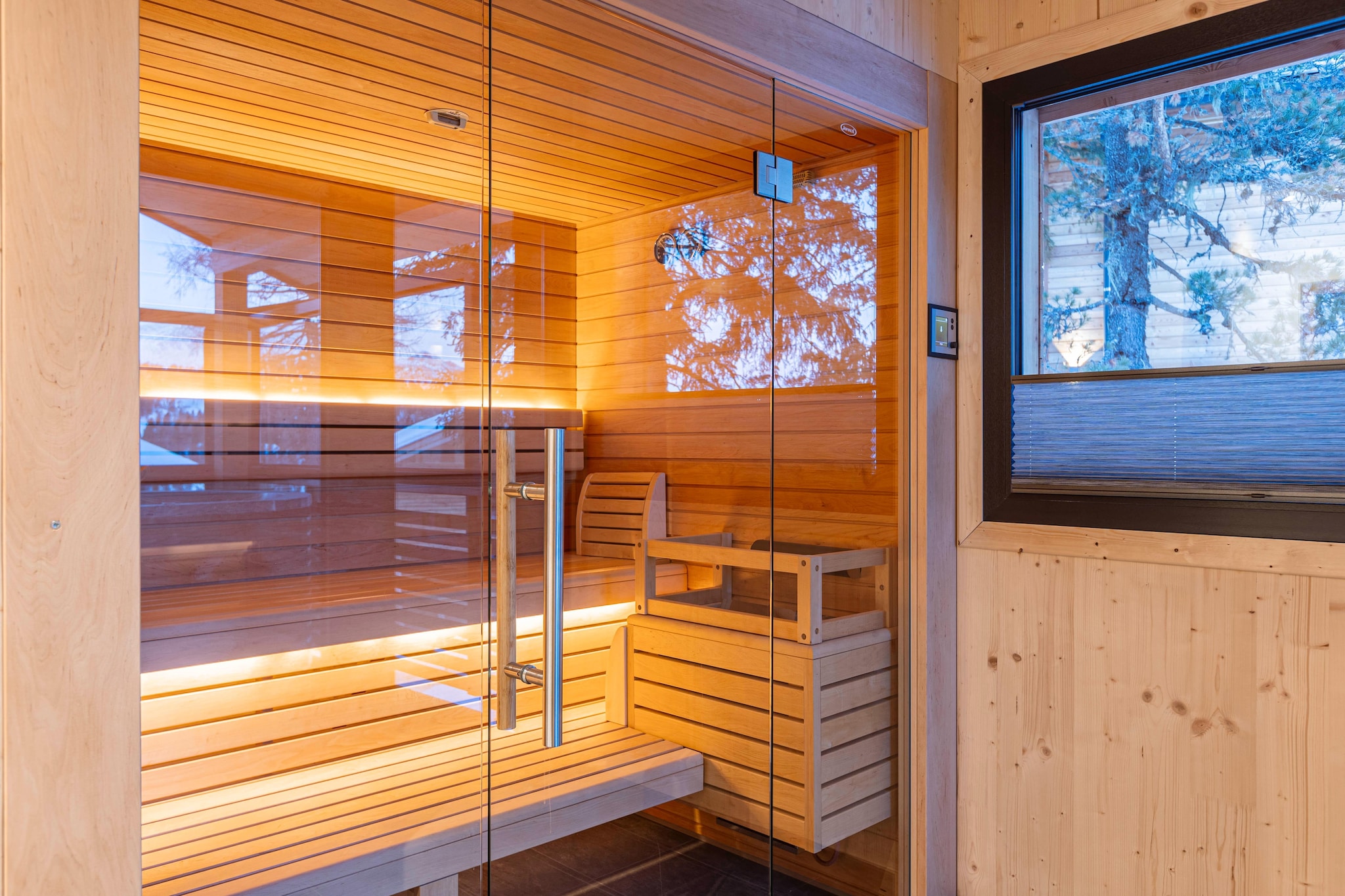 Ground floor: (Entrance(ski boot heaters), bedroom(double bed, balcony), Bedroom with bathroom(double bed, shower, toilet), Bedroom with bathroom(double bed, shower, toilet, balcony), bathroom(shower, sauna, toilet, hairdryer), Internet access, hot tub, balcony)\n\nOn the 1st floor: (Living room(TV, dining table, seating area), open kitchen(electric kettle, toaster, coffee machine(cups, espresso, filter), oven, microwave, dishwasher, fridge(+ freezer)), bedroom(double bed), bathroom(bath tub, shower), toilet, balcony)\n\nheating, garden furniture, parking, parking, terrace heater, drying cabinet