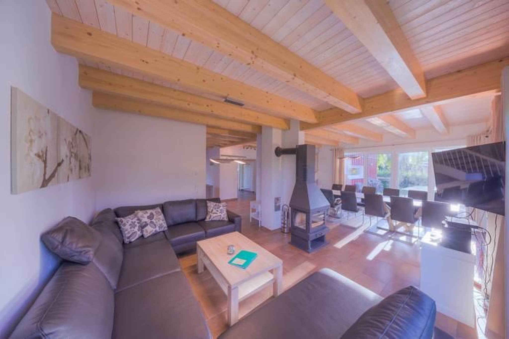 Ground floor: (open kitchen(hob, electric kettle, toaster, coffee machine, oven, microwave, dishwasher, fridge(+ freezer)), Living/diningroom(TV(satellite), dining table, fireplace, seating area), bedroom(double bed), bedroom(single bed, single bed), bathroom(Bubble bath, shower, sauna(private), washbasin, washbasin, toilet))\n\nOn the 1st floor: (Living room(TV, seating area, balcony), bedroom(single bed, single bed), bedroom(double bed), bedroom(double bed), bedroom(single bed, single bed), bathroom(bath tub, shower, washbasin, washbasin, toilet), bathroom(bath tub, shower, washbasin, washbasin, toilet), storage, storage, balcony)\n\ntumble dryer(shared with other guests, paid), washing machine(shared with other guests, paid), heating(electric, floor heating), terrace, garden, garden furniture, sun loungers, parking, parking, parking, high chair, baby crib(paid), Towels/Sheets (extra fee)