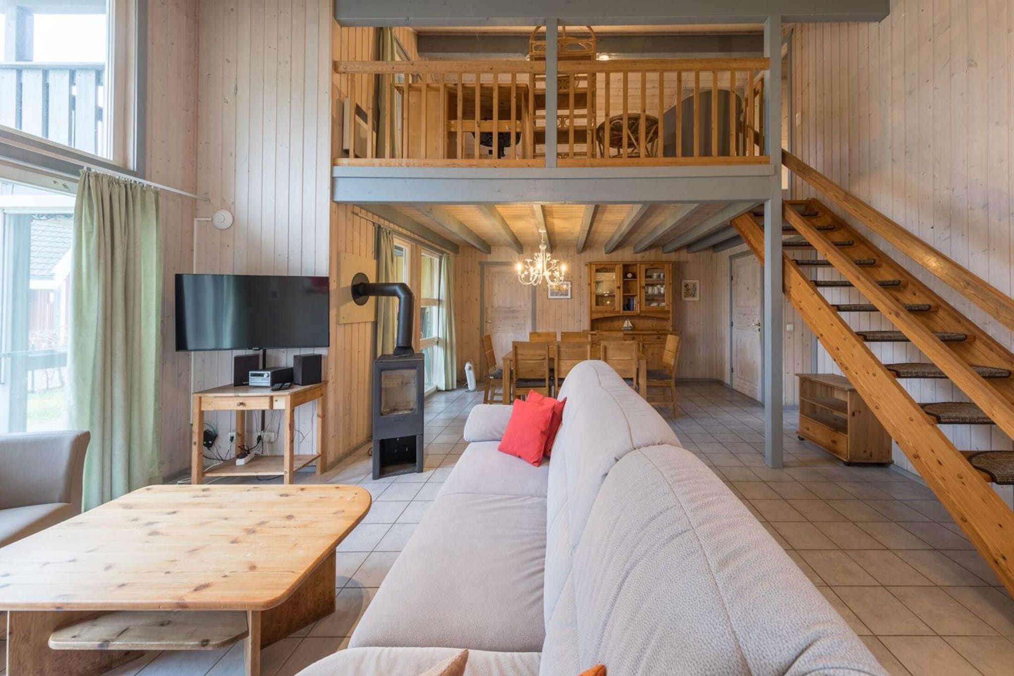 Ground floor: (Kitchen(dining table, hob, electric kettle, toaster, coffee machine, oven, dishwasher, fridge(+ freezer)), Living/diningroom(TV(satellite), dining table, fireplace, seating area), bedroom(bunk bed or 2 single beds), Bedroom with bathroom(shared entrance)(double bed, Bubble bath, washbasin, toilet), bathroom(shower, sauna(private), washbasin, toilet, hairdryer), bathroom(bath tub, washbasin, toilet, hairdryer), storage)\n\nAttic: (bedroom(single bed, single bed), Gallery bedroom(double bed, balcony))\n\ntumble dryer(shared with other guests, paid), washing machine(shared with other guests, paid), heating(electric), terrace, garden, garden furniture, sun loungers, BBQ(charcoal), parking, high chair, Charging post for electric cars, baby crib(paid), Towels/Sheets (extra fee)