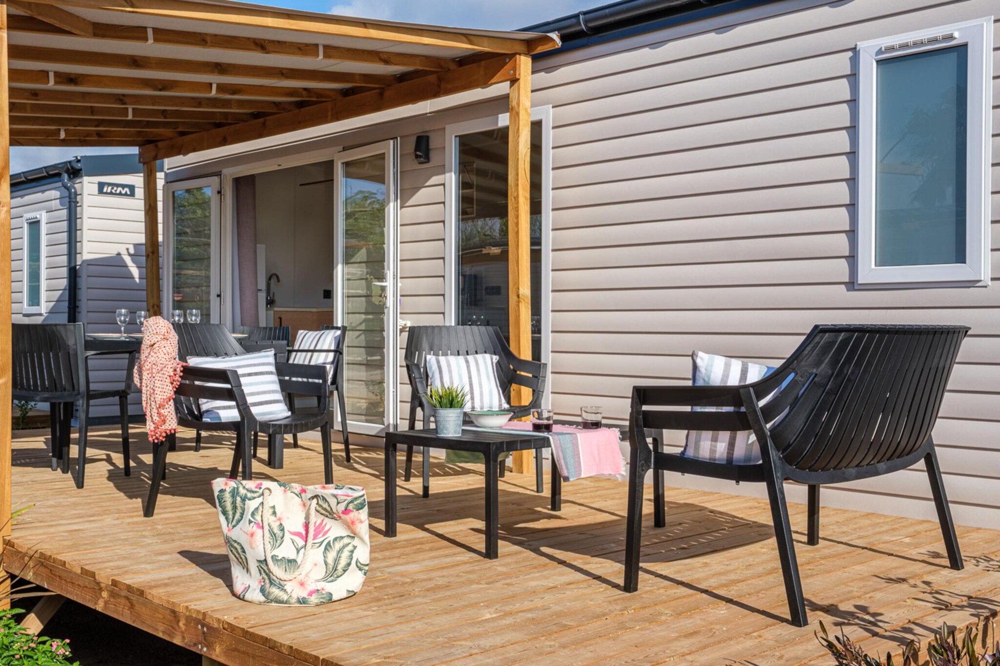 Ground floor: (Living room(TV, seating area), dining room(dining table), open kitchen(coffee machine, microwave, fridge), bedroom(double bed), bedroom(single bed, single bed), bathroom(shower, washbasin, toilet), Internet access)\n\nheating, air conditioning, terrace, garden furniture, parking