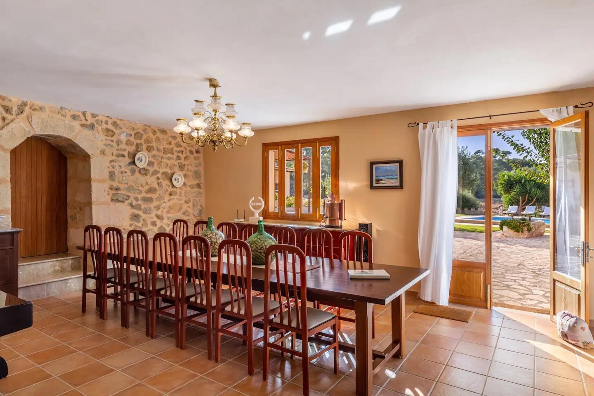 On the 1st floor: (Kitchen(dining table, toaster, cooker, coffee machine, oven, microwave, dishwasher, fridge-freezer, Juicer, dishes and cutlery), Living/diningroom(TV, dining table, fireplace, seating area), bedroom(double bed), bathroom(shower, washbasin, toilet))\n\nOn the 2nd floor: (bedroom(double bed), Bedroom with bathroom(single bed, single bed, shower, washbasin, toilet), Bedroom with bathroom(double bed, cot, shower, washbasin, toilet), Bedroom with bathroom(single bed, single bed, shower, washbasin, toilet), bathroom(shower, washbasin, toilet))\n\nveranda(dining table), garden, garden furniture, parking, swimming pool(private), hammock