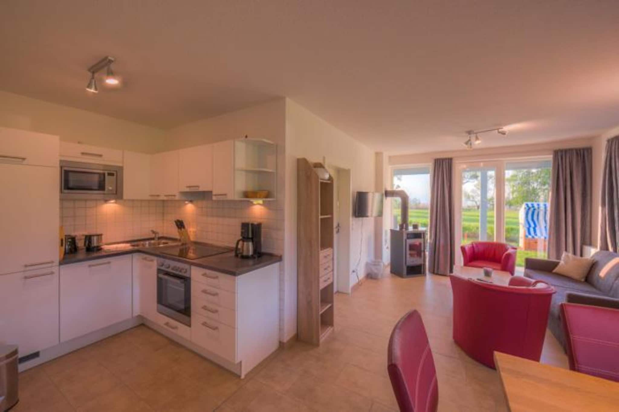 Ground floor: (open kitchen(electric kettle, toaster, cooker, coffee machine, oven, microwave, dishwasher, fridge-freezer), Living/diningroom(TV, dining table, fireplace, seating area), bedroom(double bed), bedroom(single bed, single bed), bathroom(shower, sauna(private), washbasin, toilet))\n\ncarport, cot, heating(gas), terrace, garden furniture, parking, high chair, Towels/Sheets (Incl.)