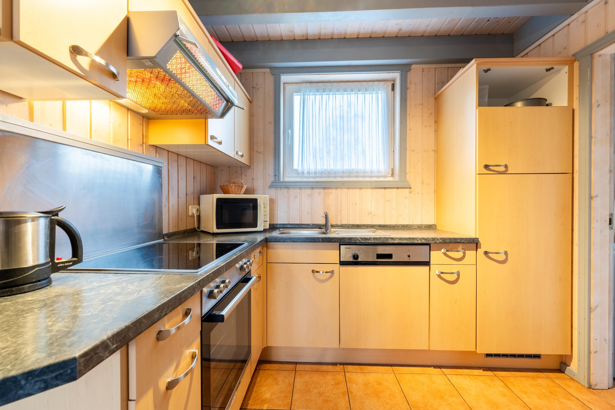 Ground floor: (open kitchen(hob(4 ring stoves, ceramic), electric kettle, toaster, coffee machine, oven, microwave, dishwasher, fridge-freezer), Living/diningroom(TV(satellite), dining table, fireplace, seating area), bedroom(double bed), bathroom(shower, washbasin, toilet), mezzanine(small double bed), Internet access)\n\nAttic: (bedroom(double bed, balcony), bedroom(single bed, single bed), bathroom(Bubble bath, shower, sauna(private), washbasin, toilet))\n\nheating(electric), terrace, garden furniture, BBQ(charcoal), parking, parking, baby crib(paid), Towels/Sheets (extra fee)