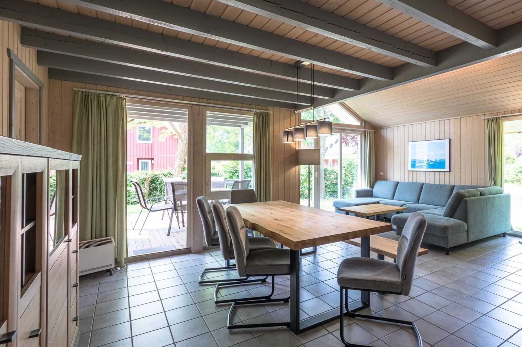 Ground floor: (Kitchen(dining table, hob, electric kettle, toaster, coffee machine, oven, dishwasher, fridge(+ freezer)), Living/diningroom(TV(satellite), dining table, fireplace, seating area, radio), bedroom(bunk bed or 2 single beds), Bedroom with bathroom(shared entrance)(double bed), bathroom(shower, sauna(private), washbasin, toilet, hairdryer), bathroom(bath tub, washbasin, toilet), storage)\n\nAttic: (bedroom(single bed, single bed), Gallery bedroom(small double bed, balcony))\n\ntumble dryer(shared with other guests, paid), washing machine, heating(electric, floor heating), terrace, garden, garden furniture, sun loungers, BBQ(charcoal), parking, high chair, baby crib(paid), Towels/Sheets (extra fee)