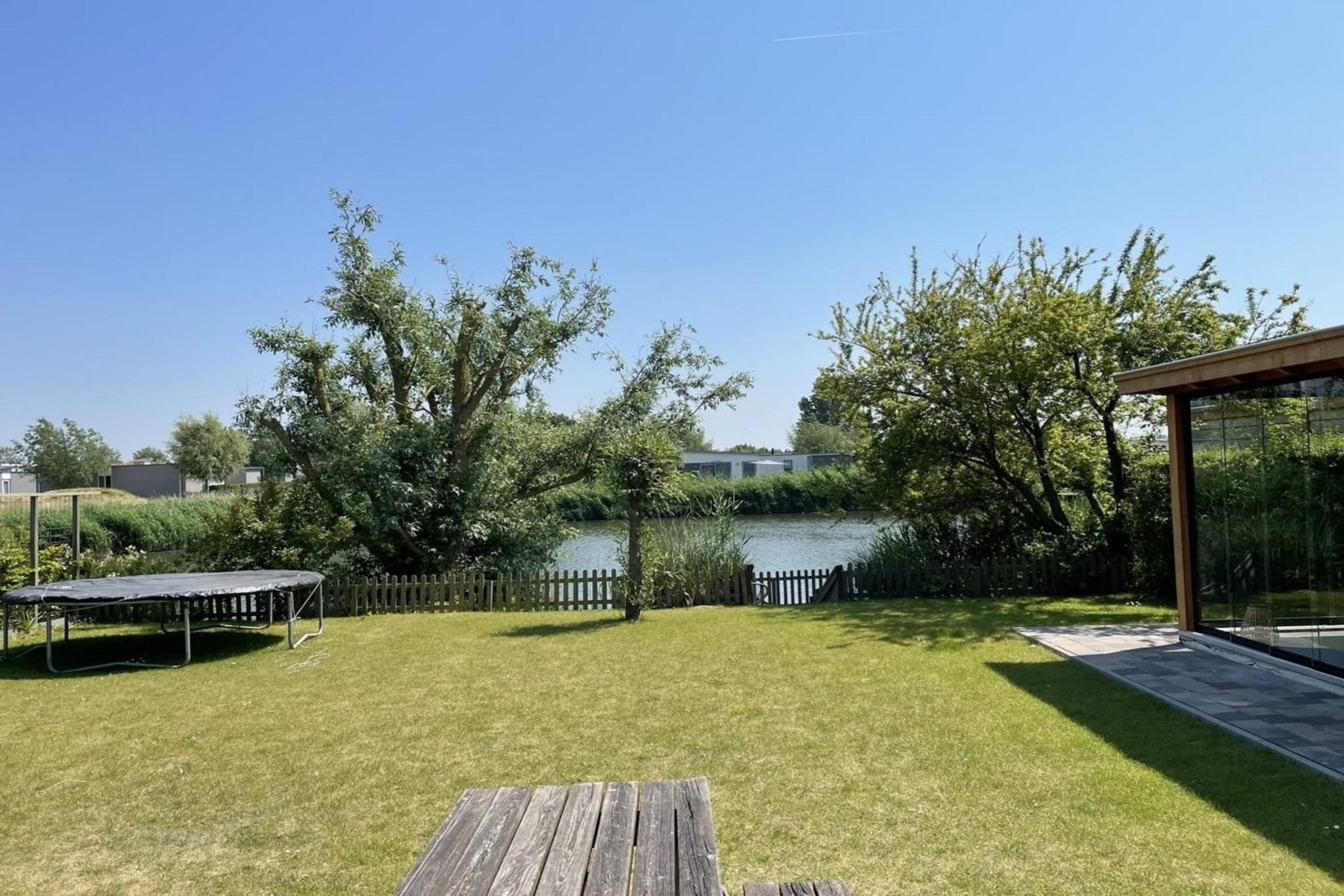 Ground floor: (Living room(TV(flatscreen), dining table, seating area), open kitchen(hob(4 ring stoves, gas), electric kettle, coffee machine(filter), microwave, dishwasher, fridge-freezer, dishes and cutlery(Bowls, chopsticks, plates, cups, etc.), Cooking basics(Pots and pans, oil, salt and pepper)), Internet access)\n\nOn the 1st floor: (bedroom(double bed), bedroom(double bed), bedroom(single bed, single bed), bathroom(bath tub, shower, washbasin, toilet))\n\nwashing machine, heating(central), terrace, garden, garden furniture, parking, parking, lounge set, Charging post for electric cars