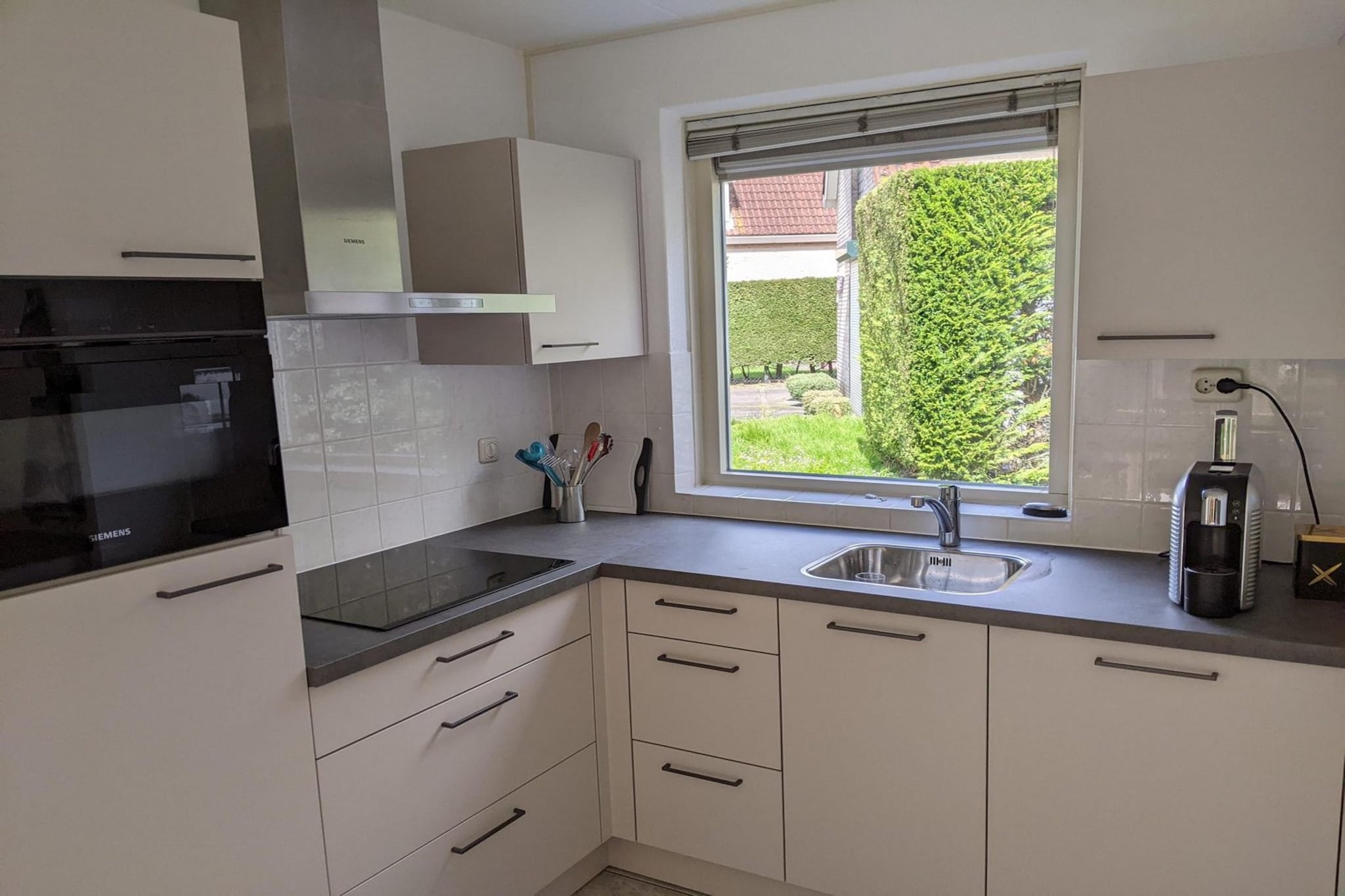 Ground floor: (Living room(TV(flatscreen), dining table, seating area), open kitchen(hob(4 ring stoves, induction), electric kettle, hood, coffee machine(filter), oven, microwave, dishwasher, fridge-freezer, dishes and cutlery(Bowls, chopsticks, plates, cups, etc.), Cooking basics(Pots and pans, oil, salt and pepper)), Internet access)\n\nOn the 1st floor: (bedroom(single bed, single bed), bedroom(single bed, single bed), bedroom(single bed, single bed), bathroom(shower, washbasin, toilet))\n\nwashing machine, heating(central), terrace, garden, garden furniture, parking