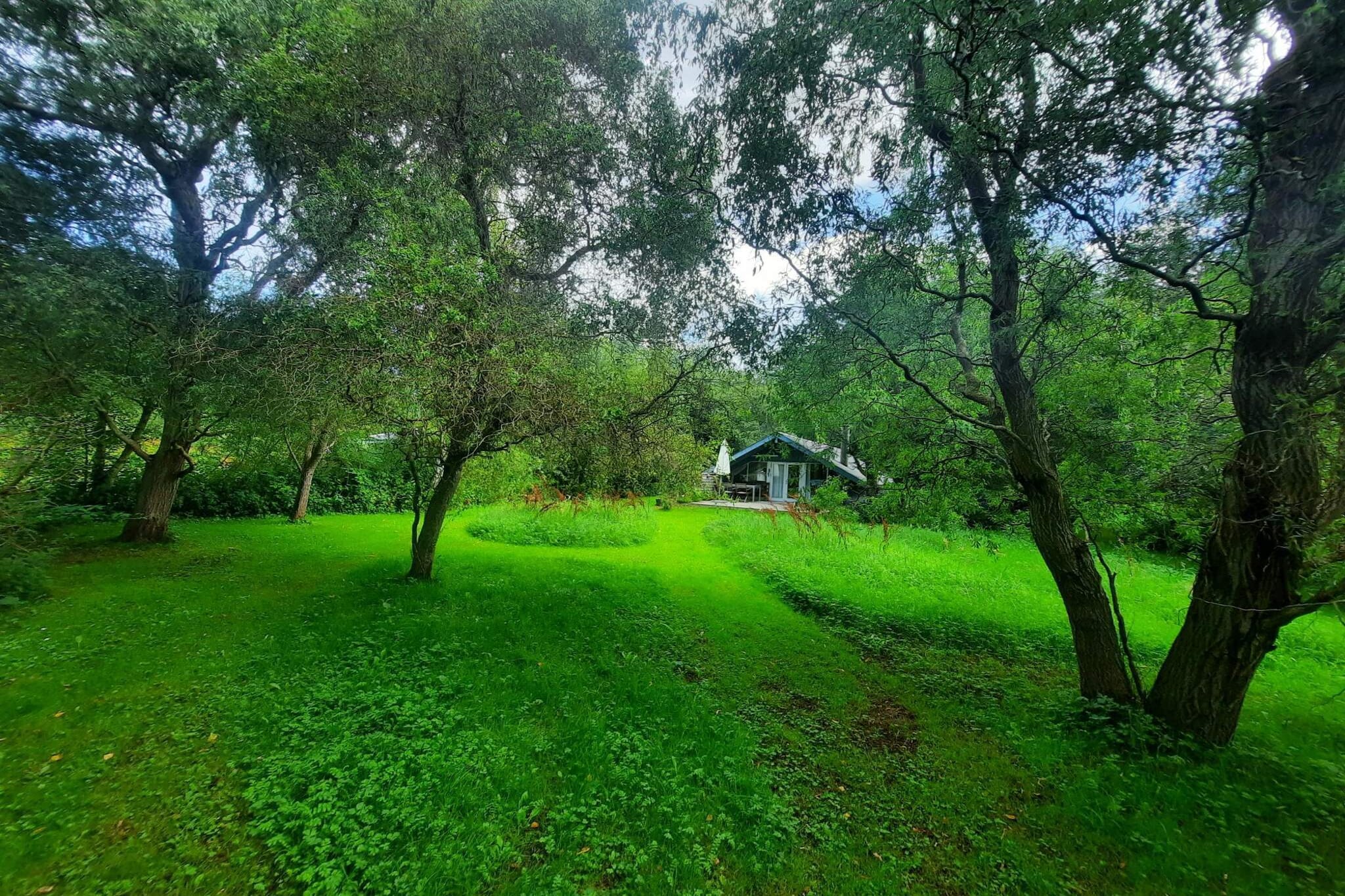 Located in the peaceful and scenic area of Stenstrup Lyng, this charming holiday cottage offers a welcoming retreat just a short stroll from a child-friendly beach. The house features an entrance hall leading to two cozy bedrooms — one with a double bed, the other with two singles — and a bright bathroom with a skylight. The open-plan kitchen, dining area, and living room with a wood-burning stove create a warm and inviting atmosphere, with direct access to the furnished terrace and beautifully landscaped garden. The large 1,227 m² garden provides plenty of space to relax or play, and the terrace is perfect for outdoor meals, enjoying the sun, or simply embracing the peace and quiet of the surroundings. An additional annex beside the main house offers two more sleeping spots, complete with electricity and heating. With modern comforts like electric heating and a heat pump, this non-smoking house is ideal for year-round stays. Please note: it is not rented to youth groups. Situated in Northwest Zealand, the area is known for its natural beauty and diverse landscape — from the dunes and white-sand beaches along Sejerø Bugt to the green fields and coastal meadows of Isefjord. The region is dotted with historic market towns like Nykøbing Sjælland, charming harbors, and ancient monuments in the hilly Odsherred landscape. Whether you’re hiking, swimming, or sightseeing, this part of Denmark offers a tranquil and authentic holiday experience.A refundable deposit might be charged closer to your check-in date. The security deposit ensures a smooth stay and covers any additional services or consumption charges.This deposit covers utilities consumed during your stay and any additional services that may be taken.The final amount will be adjusted based on actual meter readings, actual usage of extra services, and any remaining balance will be refunded within 21 days after checkout.This deposit simply acts as a prepayment for charges that  you would anyways pay for, ensuring a seamless stay and check-out experience.