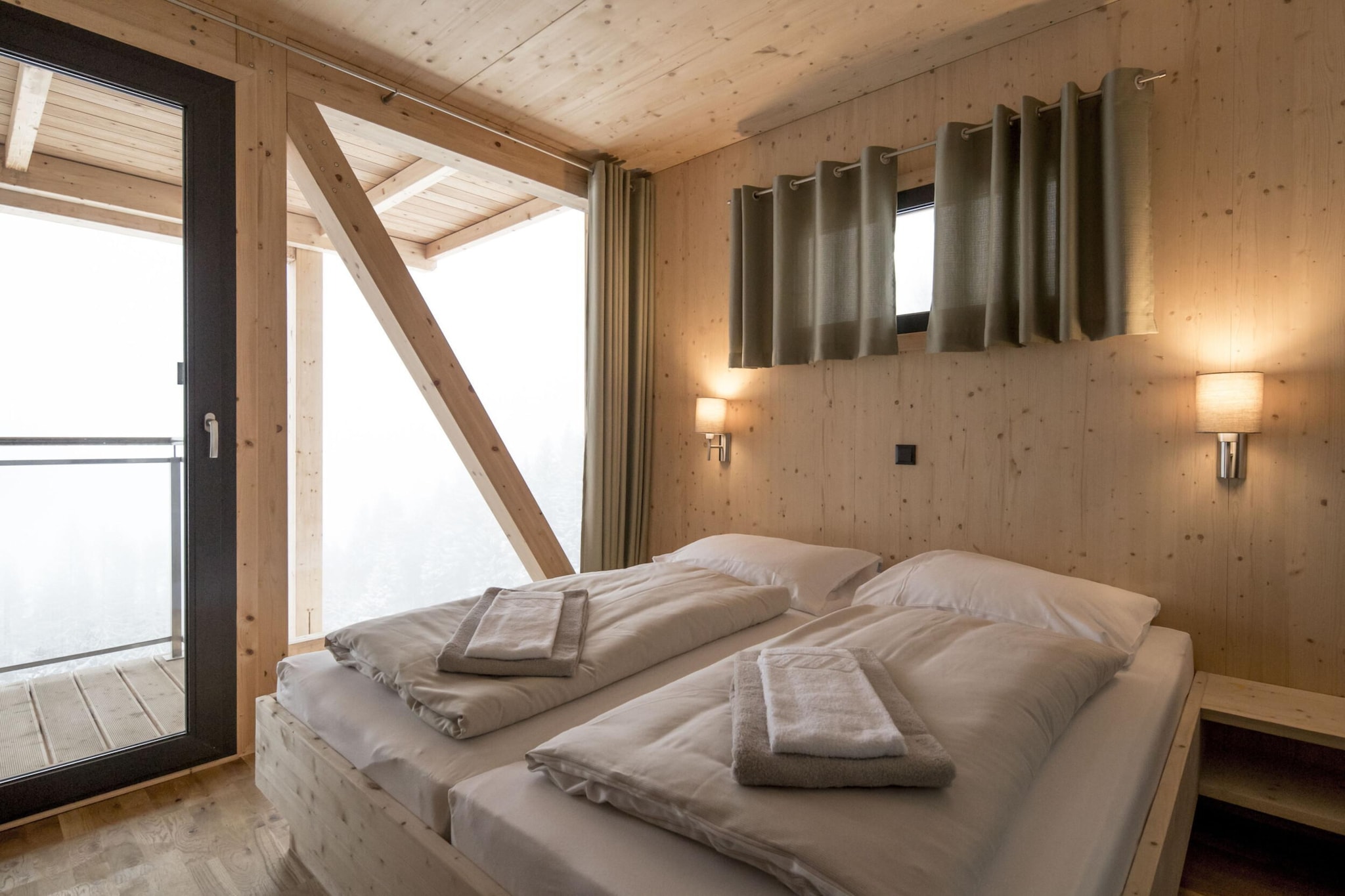 Ground floor: (bedroom(double bed), bedroom(double bed, shower), Bedroom with bathroom(double bed, shower), Bedroom with bathroom(bunk bed, bunk bed), bathroom(bath tub, Bubble bath, sauna, hairdryer), toilet(toilet), toilet(toilet), toilet(toilet), Internet access)\n\nOn the 1st floor: (Living room(TV(cable, satellite), balcony, gas fireplace), open kitchen(hob(4 ring stoves, ceramic), electric kettle, toaster, coffee machine(filter), oven, microwave, dishwasher, fridge(+ freezer), dishes and cutlery(Bowls, chopsticks, plates, cups, etc.)), balcony, terrace)\n\nstorage, ski boot heaters, heating(central), garden furniture, parking, drying cabinet