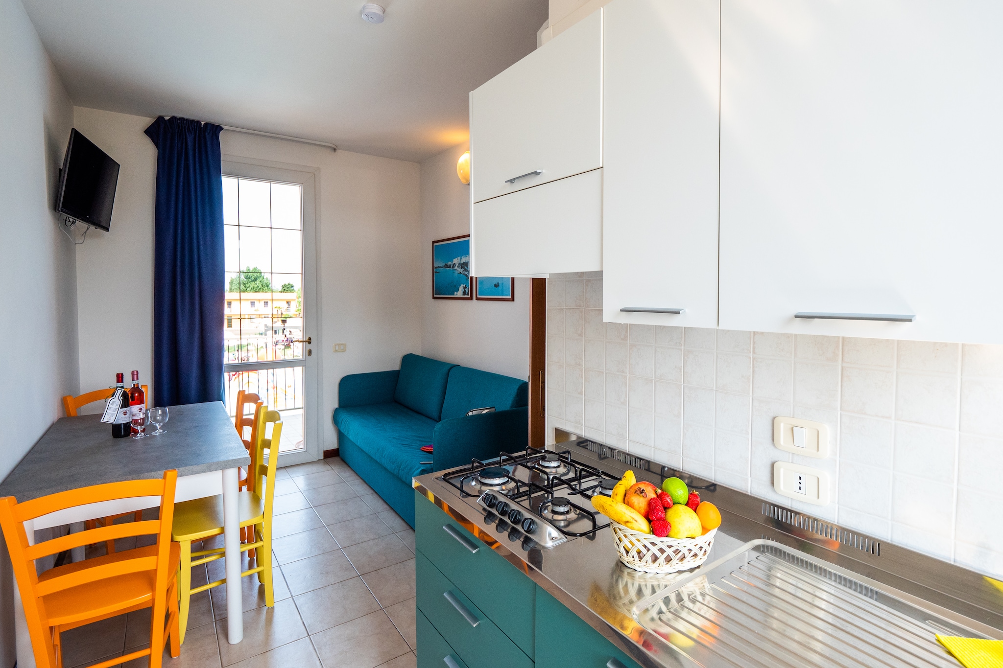 On the 1st floor: (Kitchenette(hob(4 ring stoves, gas), fridge-freezer), Living/diningroom(double sofa bed, TV(satellite), dining table), bedroom(double bed, air conditioning), bedroom(single bed, single bed), bathroom(bathtub or shower, toilet), balcony, garden furniture, sun loungers)\n\nReception, Washing facilities, Parking, Waterslide, Mini market, Bike rental, Table tennis, Restaurant, Bar, Indoor playroom, Kids club, Play area, sun loungers, parasol, swimming pool(shared with other guests, outside)
