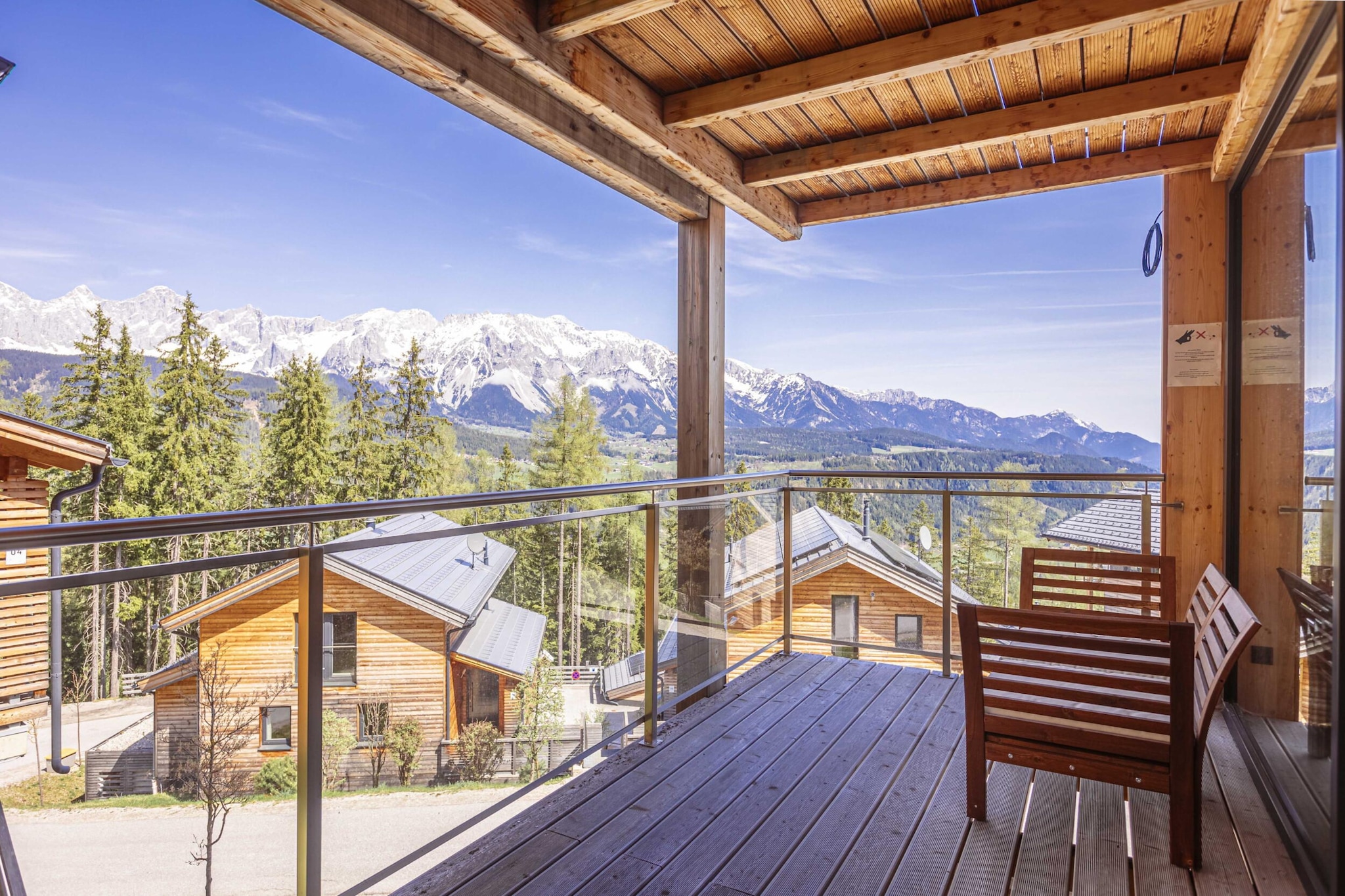 Ground floor: (bedroom(single bed, bunk bed), Bedroom with bathroom(double bed, shower), Bedroom with bathroom(double bed, shower), Bedroom with bathroom(double bed, shower), bathroom(bath tub, Bubble bath, sauna, hairdryer), toilet(toilet), Internet access)\n\nOn the 1st floor: (Living room(TV(cable, satellite), balcony, gas fireplace), open kitchen(hob(4 ring stoves, ceramic), electric kettle, toaster, coffee machine(filter), oven, microwave, dishwasher, fridge(+ freezer), dishes and cutlery(Bowls, chopsticks, plates, cups, etc.)), balcony)\n\nstorage, ski boot heaters, balcony or terrace, heating(central), garden furniture, parking, drying cabinet