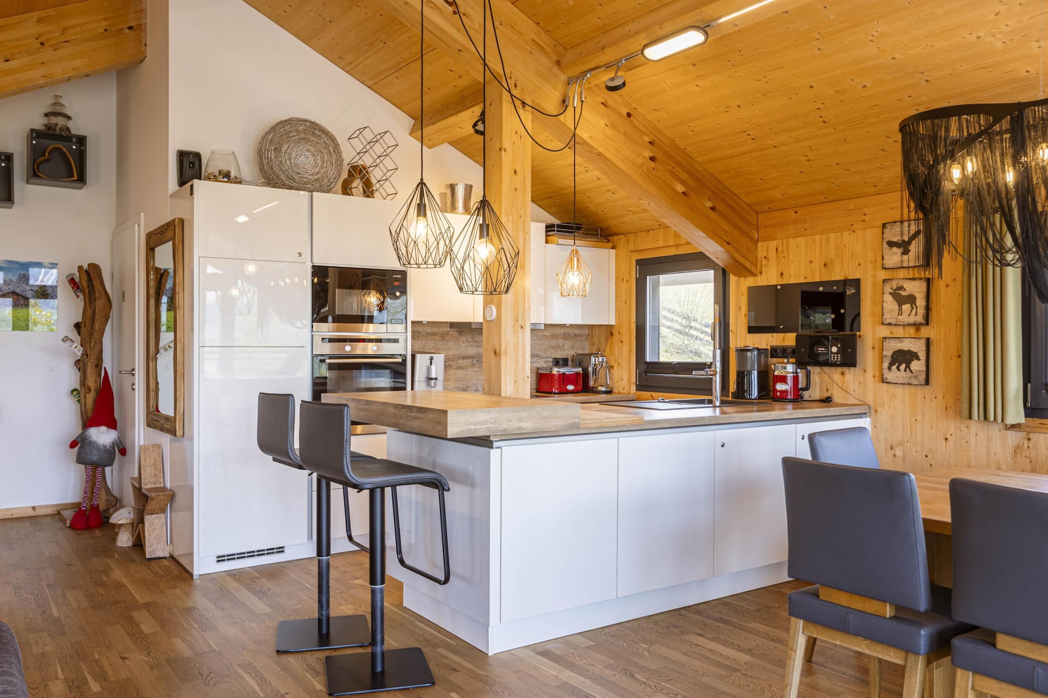 Ground floor: (bedroom(double bed), Bedroom with bathroom(double bed, shower), Bedroom with bathroom(double bed, shower), Bedroom with bathroom(bunk bed, shower), bathroom(bath tub, Bubble bath, sauna, hairdryer), toilet(toilet), toilet(toilet), Internet access)\n\nOn the 1st floor: (Living room(TV(cable, satellite), balcony, gas fireplace), open kitchen(hob(4 ring stoves, ceramic), electric kettle, toaster, coffee machine(filter), oven, microwave, dishwasher, fridge(+ freezer), dishes and cutlery(Bowls, chopsticks, plates, cups, etc.)), toilet(toilet), balcony, terrace)\n\nstorage, ski boot heaters, heating(central), garden furniture, parking, drying cabinet