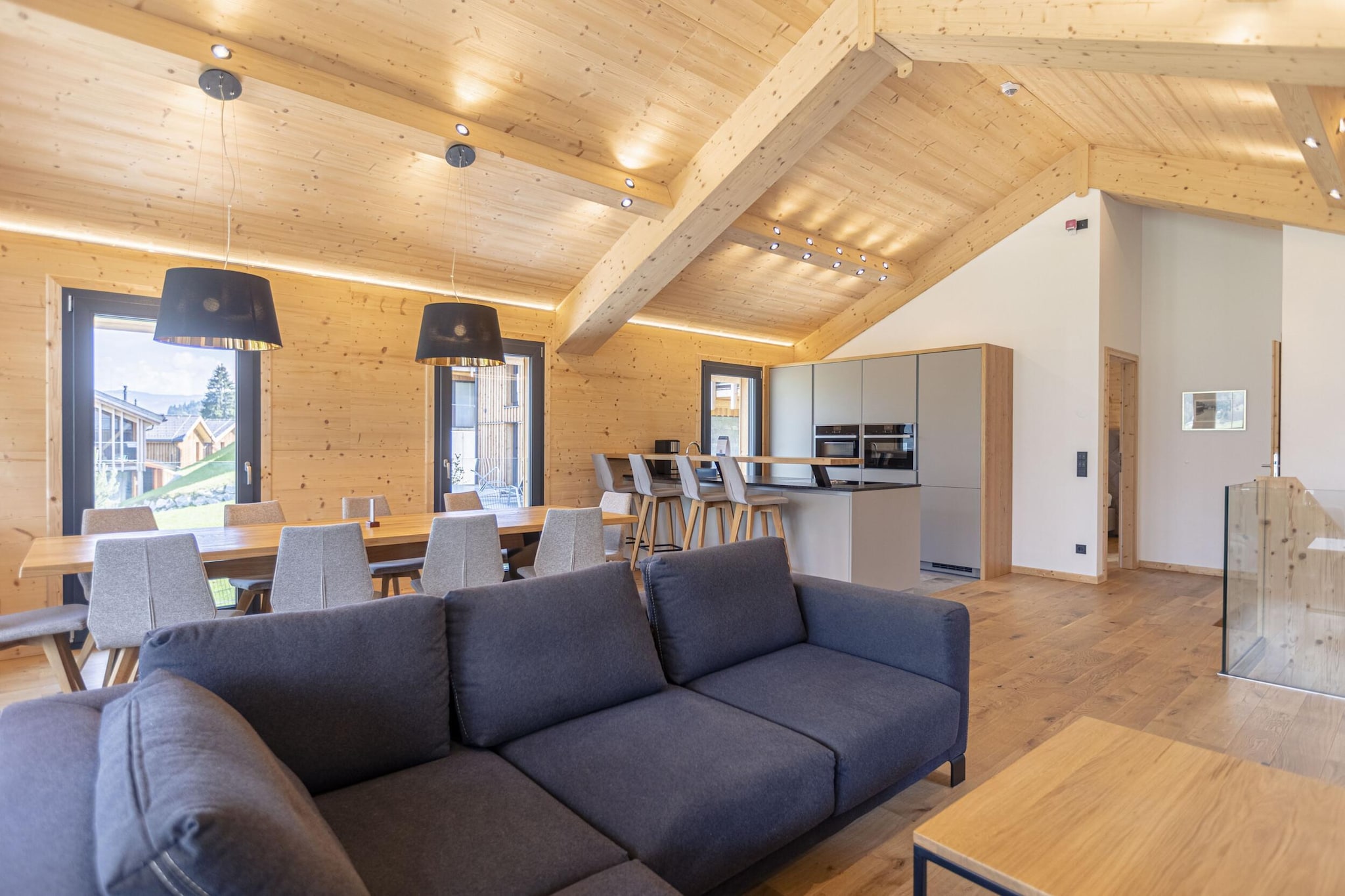 Ground floor: (Entrance, bedroom(double bed), Bedroom with bathroom(double bed, shower, toilet, hairdryer), Bedroom with bathroom(double bed, shower, toilet), bathroom(shower), bathroom(bath tub), Internet access, balcony)\n\nOn the 1st floor: (Living room(TV(satellite), seating area), dining room(dining table), open kitchen(hob(4 ring stoves, ceramic, induction), electric kettle, toaster, coffee machine(espresso, filter), oven, dishwasher, fridge-freezer, dishes and cutlery(Bowls, chopsticks, plates, cups, etc.)), bedroom(double bed, bunk bed))\n\nbath tub, sauna, swimming pool(shared with other guests, outside), gas fireplace