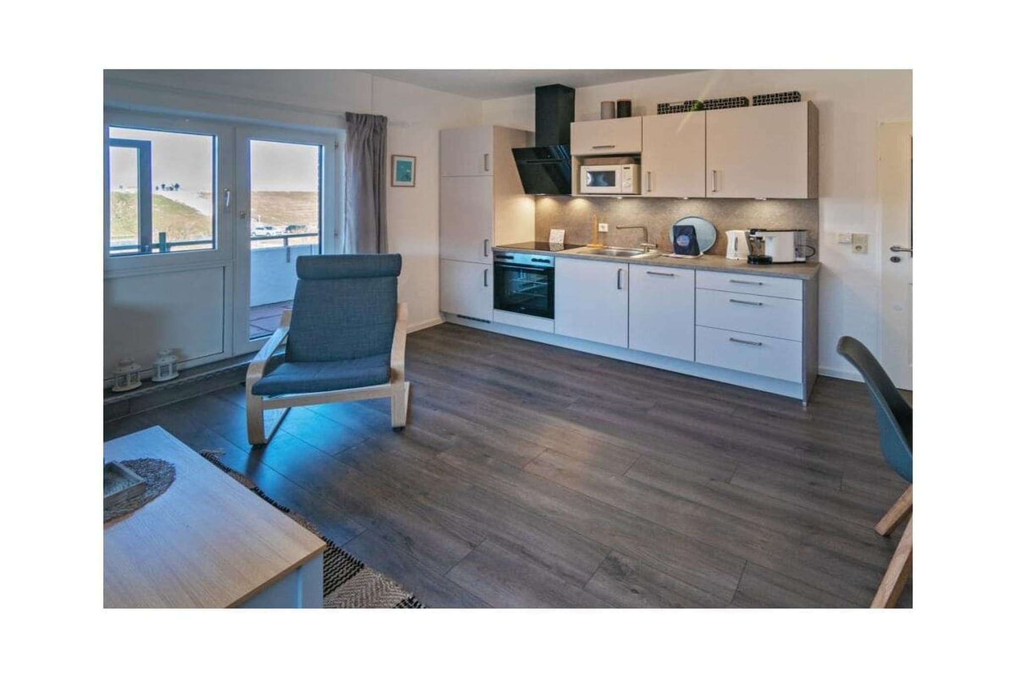 Ground floor: (Living room(single sofa bed, TV, radio), Kitchen(hob, electric kettle, toaster, cooker, coffee machine, oven, microwave, dishwasher, fridge, freezer, high chair), bedroom(double bed, children\'s bed), bathroom(shower, toilet, hairdryer))\n\nbalcony