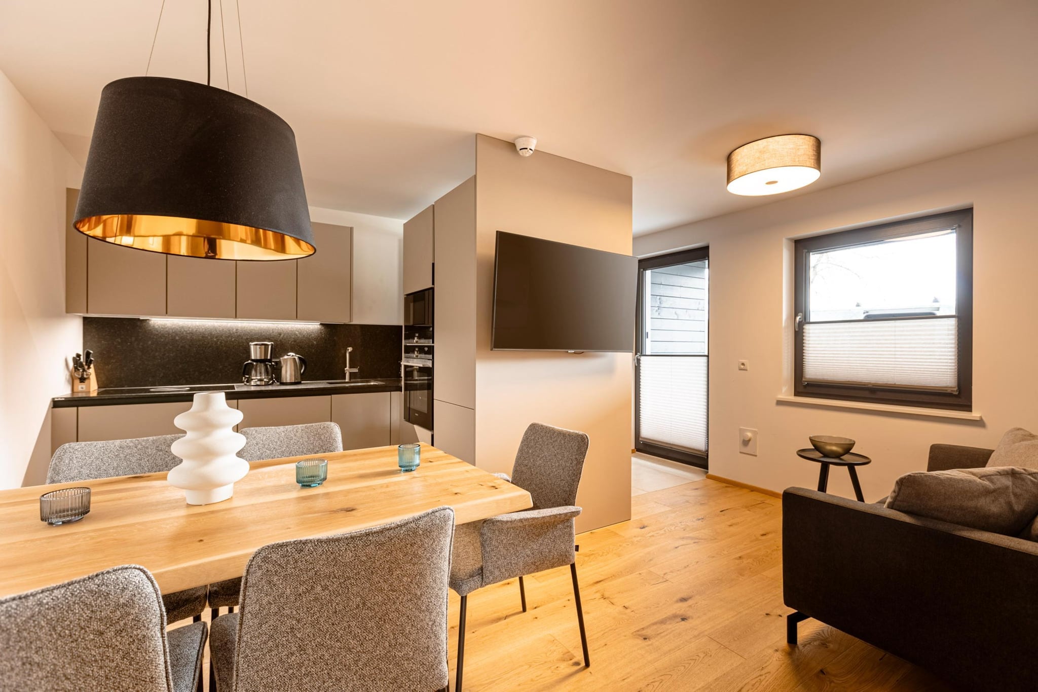 Welcome to our stylish 74 mÂ² Superior apartment, designed to provide the ultimate comfort for up to 6 guests. This modern retreat features two inviting bedrooms, each furnished with luxurious box-spring double beds, ensuring a restful night's sleep. The apartment includes two well-appointed bathrooms, each equipped with a shower, toilet, and a hairdryer for your convenience. 

The spacious open plan living and dining area offers ample room for relaxation and socializing. A cozy seating area complements a flat-screen TV, and a comfortable sofa bed provides additional sleeping space for two guests. Depending on your apartmentâ€™s location, you can access either a private balcony or terrace, perfect for enjoying the surrounding views. The apartment's stylish kitchenette is fully equipped to cater to all your culinary needs. It includes cutlery, cookware, a ceramic hob, oven, fridge with freezer compartment, and a dishwasher. Additional conveniences such as a toaster, kettle, and coffee machine are also provided. A small starter set with a dishwasher tab, sample dishwashing liquid, sponge, garbage bags, cleaning supplies, and a tea towel is available upon arrival to help you settle in. For those traveling with pets, dogs are welcome in the Superior apartment upon request (for a fee).  

Guests also have access to free Wi-Fi. Please note that all images are sample images, as each apartment is individually decorated. Additionally, the TennengauPLUS Card is included, providing access to various local discounts and offers. 

Please be aware of the pool's opening hours: 

- Winter (01.10 - 30.04): 16:00 - 19:00 

- Summer (01.05 - 30.09): 10:00 - 18:00