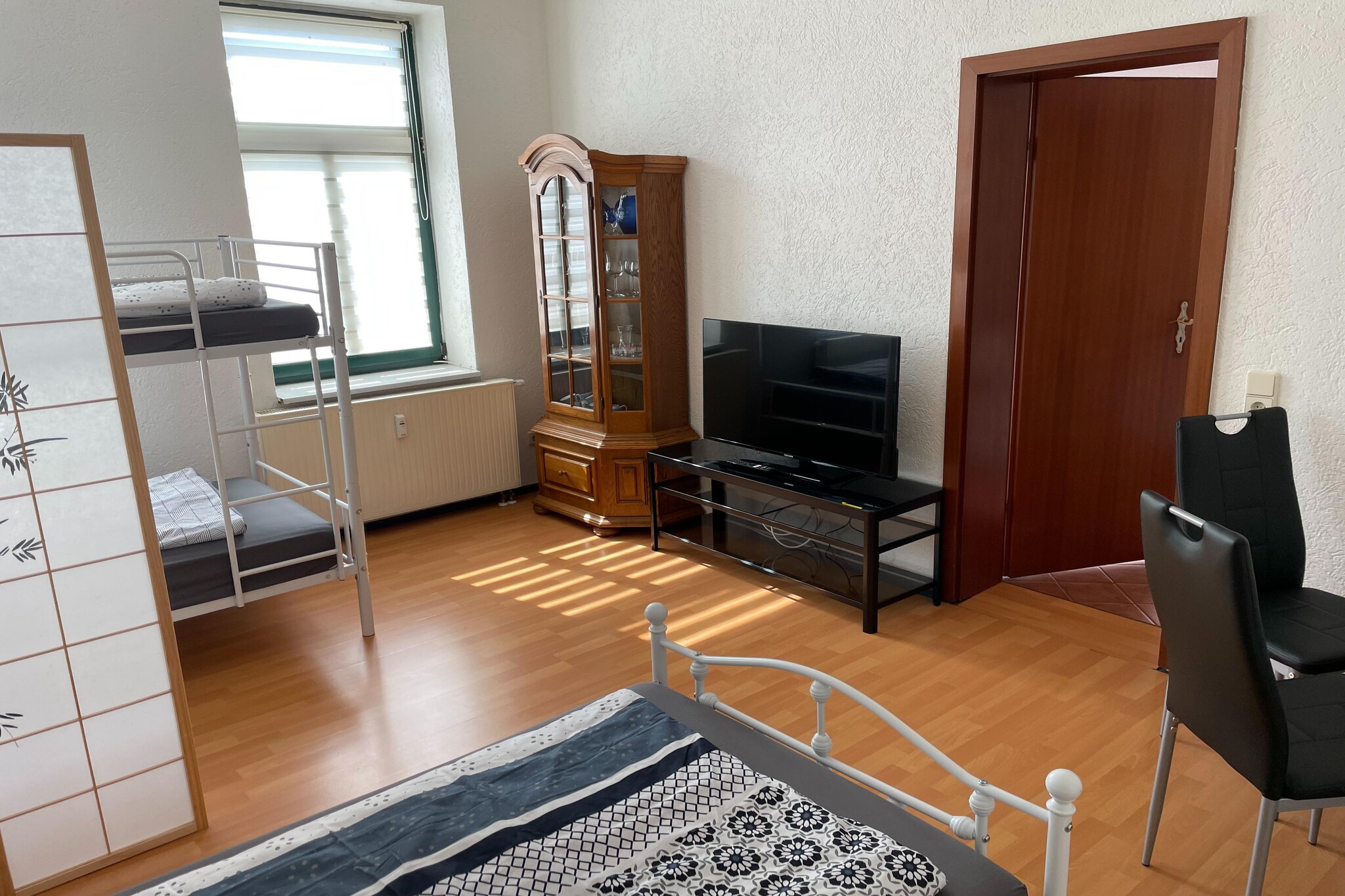 Located on the second floor of a residential building in Eilenburg, Saxony, this cozy apartment is perfect for up to 3 guests. The combined living/bedroom features a single bed, bunk bed, TV, seating area, and dining table, making it ideal for solo travelers, friends, or small families.

The well-equipped kitchen includes a coffee machine, toaster, electric kettle, oven, microwave, hood, and fridge, offering everything needed for self-catering. The bathroom comes with a shower, washbasin, toilet, hairdryer, and a washing machine for added convenience.

Guests can relax outdoors on the terrace, with garden furniture and a barbecue available. Parking is provided on-site.

With restaurants (250 m) and cafÃ©s (300 m) within walking distance, and attractions like DÃ¼bener Heide nature park (50 m), Schloss Wurzen (12 km), and Kletterwald Leipzig (16 km) nearby, this apartment offers a great base for exploring both nature and city life. The Leipzig/Halle Airport is just 23 km away, making it easily accessible for travelers.