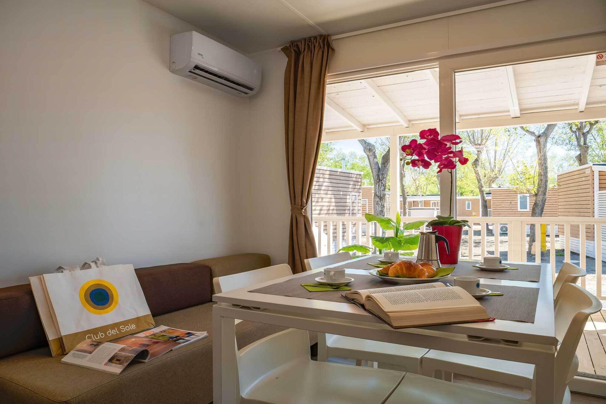 Ground floor: (Living room(single sofa bed, TV), Kitchenette(hob(gas), microwave, dishwasher, fridge-freezer), bedroom(double bed), bedroom(single bed, single bed, single loft bed), bathroom(shower, toilet, bidet, hairdryer), bathroom(shower, toilet, bidet, hairdryer), veranda(Garden Furniture ), air conditioning)\n\nReception, Washing facilities, Parking, Animation team, Super market, Bike rental, Sporting field(s), Table tennis, Restaurant, Bar, Kids club, Play area, Bubble bath, sun loungers, parasol, swimming pool(shared with other guests, outside, including part for children (depth 50cm), opened from 1/2 May upto and including 1/2 Sep), padel court