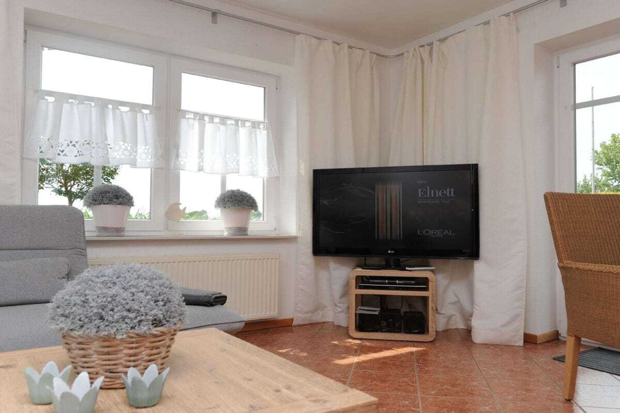 Ground floor: (hallway(Mirror, Wardrobe Coatrack), Living room(Sofa, TV, dining table, DVD player, stereo unit), open kitchen(Egg Cooker, Mixer, Tea Towels, hob, electric kettle, toaster, coffee machine, oven, dishwasher, fridge), bedroom(Wardrobe, double bed), bedroom(Wardrobe, double bed), bathroom(Mirror, shower, washbasin, toilet, heating), storage(Vacuum Cleaner, washing machine, iron, drying cabinet))\n\nHot Water, Internet Access DSL, Vacuum Cleaner, Internet access, heating, terrace(garden furniture, awning), parking, iron, drying cabinet