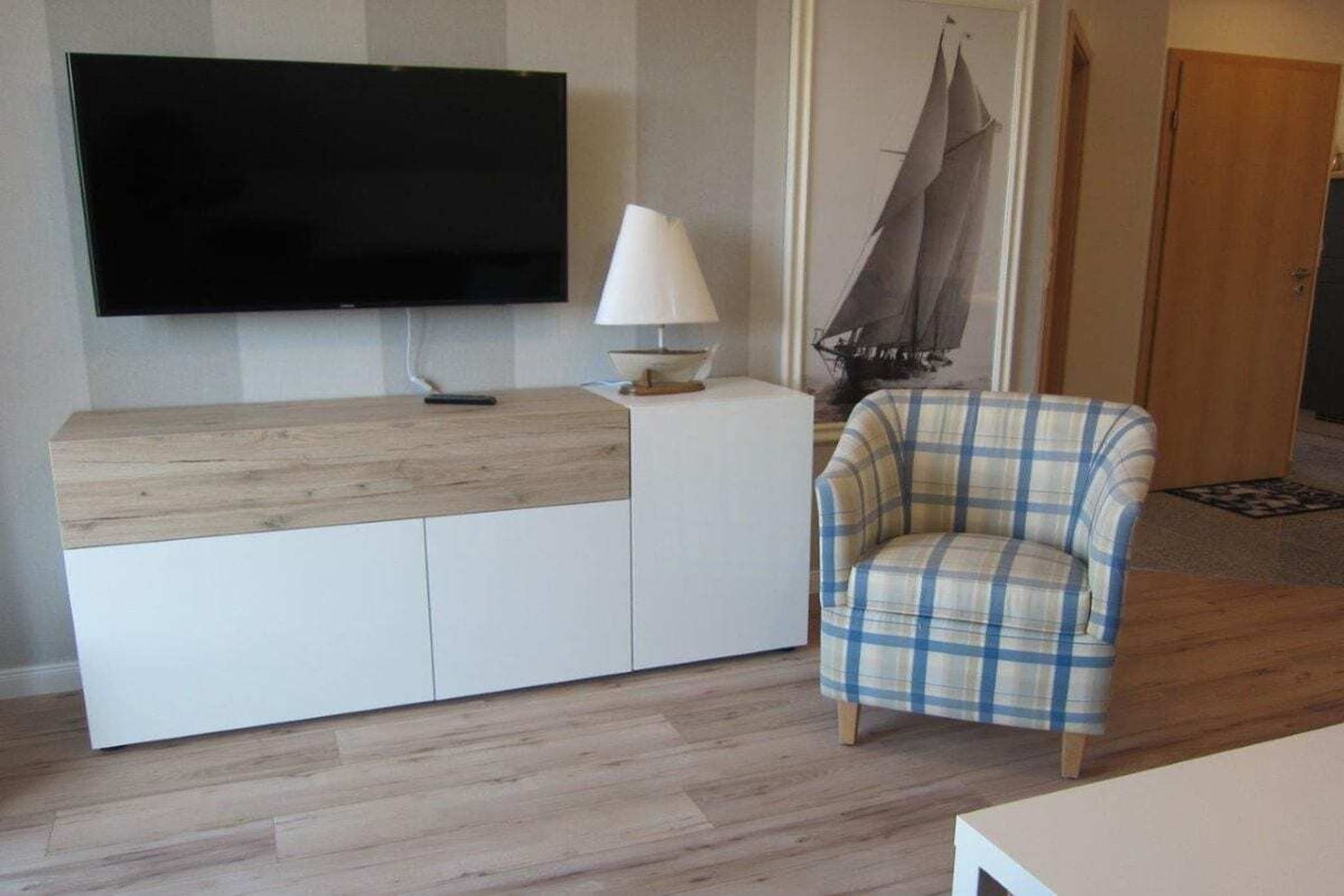 On the 1st floor: (open kitchen(Egg Cooker, Mixer, TV, dining table, stove, hob, electric kettle, toaster, coffee machine, oven, microwave, dishwasher, fridge, freezer), bedroom(Wardrobe, double bed), bedroom(Wardrobe, double bed, TV), bathroom(Mirror, toilet, bath tub, shower, washbasin, heating))\n\nFire Alarm, Hot Water, Internet Access ISDN, Vacuum Cleaner, carport, Internet access, Internet access, balcony(Sun Umbrella, garden furniture), heating, terrace(Beach, garden furniture), iron