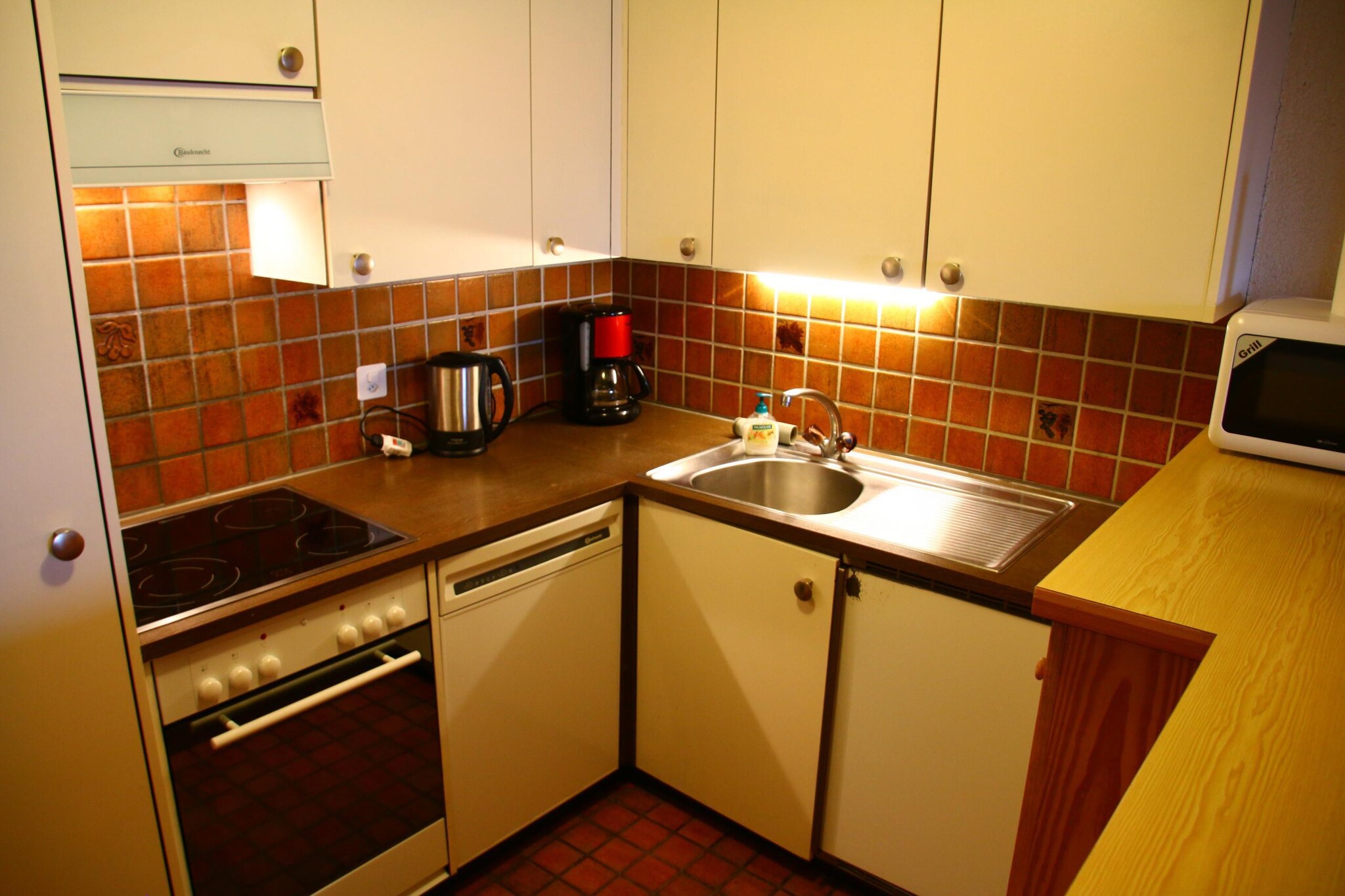 On the 1st floor: (Living room(double sofa bed(140 x 200 cm), TV(cable, satellite), dining table, fireplace, seating area, DVD player, radio), open kitchen(electric kettle, toaster, coffee machine(filter), oven, microwave, dishwasher, fridge-freezer, dishes and cutlery(Bowls, chopsticks, plates, cups, etc.)), bedroom(single bed(90 x 200 cm), single bed(90 x 200 cm)), bedroom(single bed(90 x 200 cm), single bed(90 x 200 cm)), bedroom(bunk bed(90 x 200 cm)), bathroom(bath tub, shower, washbasin, toilet), bathroom(shower, toilet), Internet access)\n\nski storage, washing machine, balcony, heating(central), garden furniture, parking, swimming pool(shared with other guests), lift