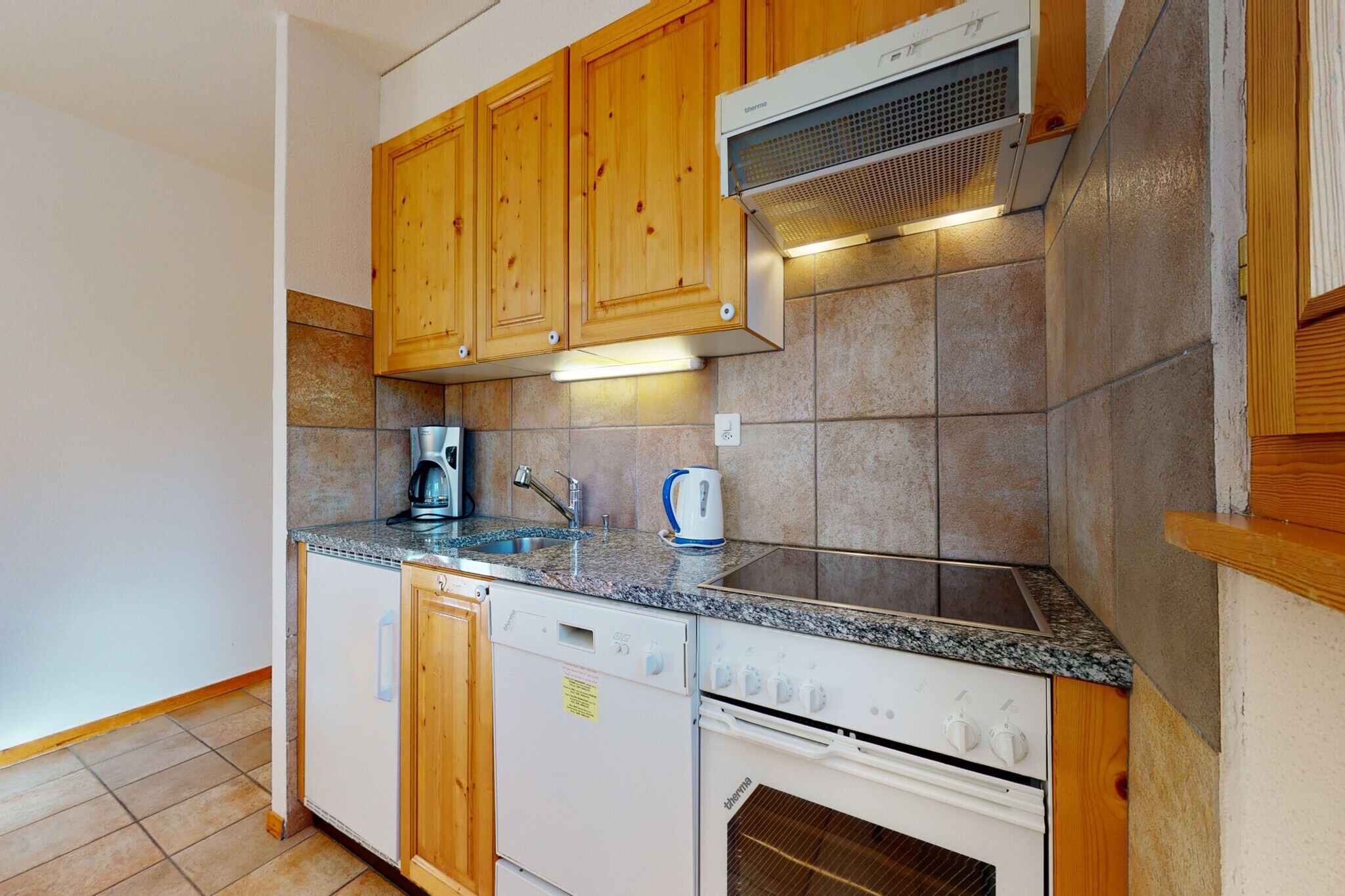 On the 2nd floor: (Living room(TV(cable, satellite), fireplace, seating area, DVD player, radio), open kitchen(dining table, hob(4 ring stoves), electric kettle, hood, coffee machine(filter), oven, microwave, dishwasher, fridge-freezer, dishes and cutlery(Bowls, chopsticks, plates, cups, etc.)), bedroom(single bed(90 x 200 cm), bunk bed(90 x 200 cm)), Bedroom with bathroom(double bed(90 x 200 cm), bath tub, toilet), bathroom(shower, toilet), balcony)\n\nski storage, washing machine, heating(central), garden furniture, swimming pool(shared with other guests), lift, Laundry Package incl.