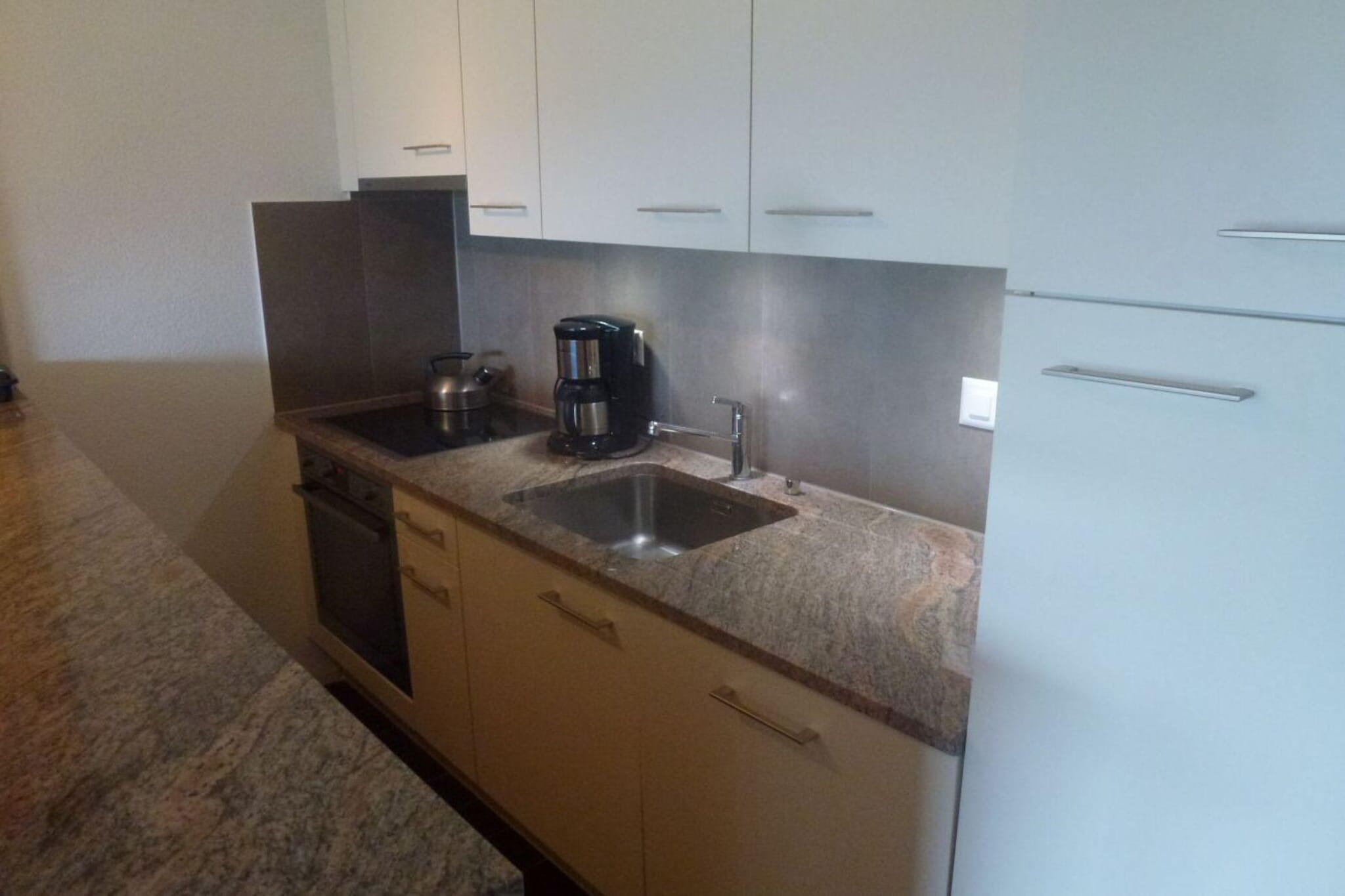 Ground floor: (Living room(double sofa bed, TV(cable, satellite), dining table, fireplace, seating area, radio), open kitchen(hob(ceramic), toaster, coffee machine, oven, microwave, dishwasher, fridge, freezer, dishes and cutlery, Cooking basics), Living/bed room(single bed(90 x 200 cm)), bedroom(single bed(90 x 200 cm), single bed(90 x 200 cm)), bedroom(bunk bed(90 x 200 cm)), bathroom(shower, washbasin, toilet), toilet(toilet), Internet access)\n\nski storage, tumble dryer, washing machine, heating(central), terrace(16 m2), garden, garden furniture, parking, swimming pool(shared with other guests), Laundry Package incl.